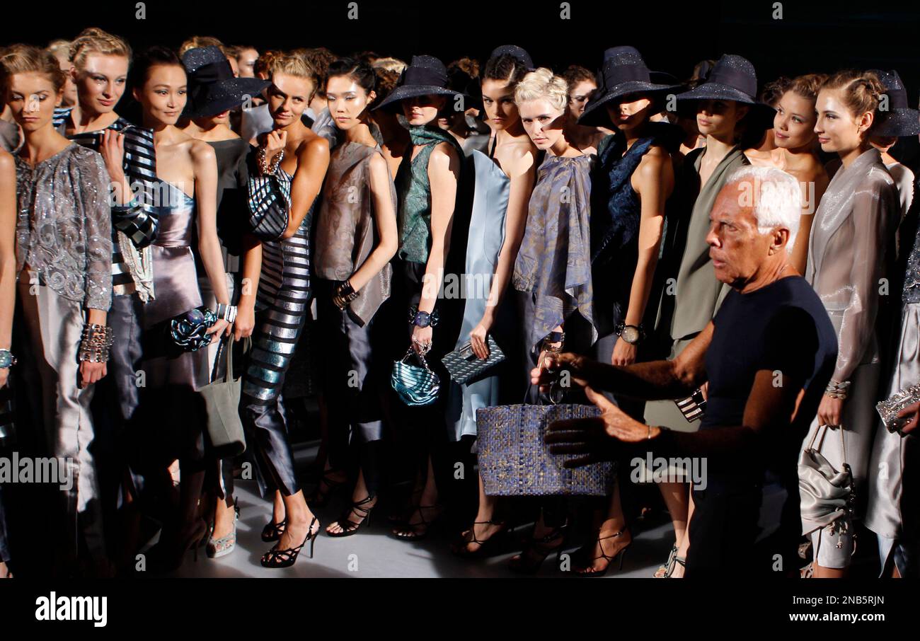 Italian fashion designer Giorgio Armani talks to models after presenting  his Giorgio Armani women's Spring-Summer 2012 fashion collection in Milan,  Italy, Monday, Sept. 26, 2011. (AP Photo/Luca Bruno Stock Photo - Alamy