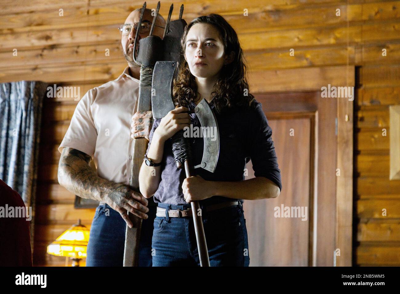 KNOCK AT THE CABIN, from left Dave Bautista, Abby Quinn, 2023. ph