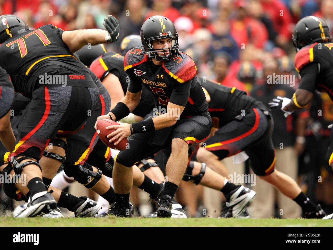 Maryland quarterback Danny O'Brien, center, looks to hand off a ball in ...