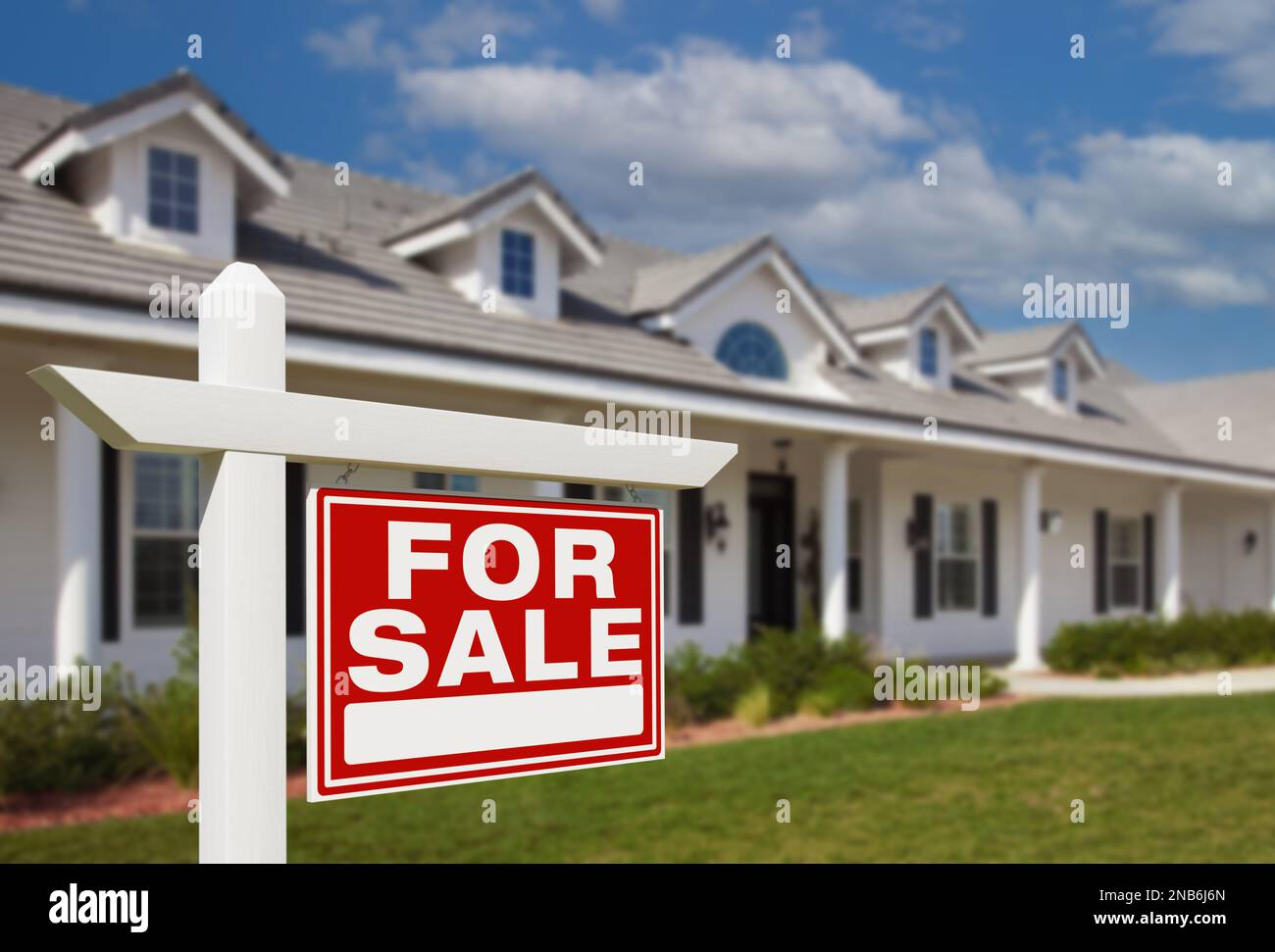 For Sale Real Estate Sign in Front of New House Stock Photo - Alamy