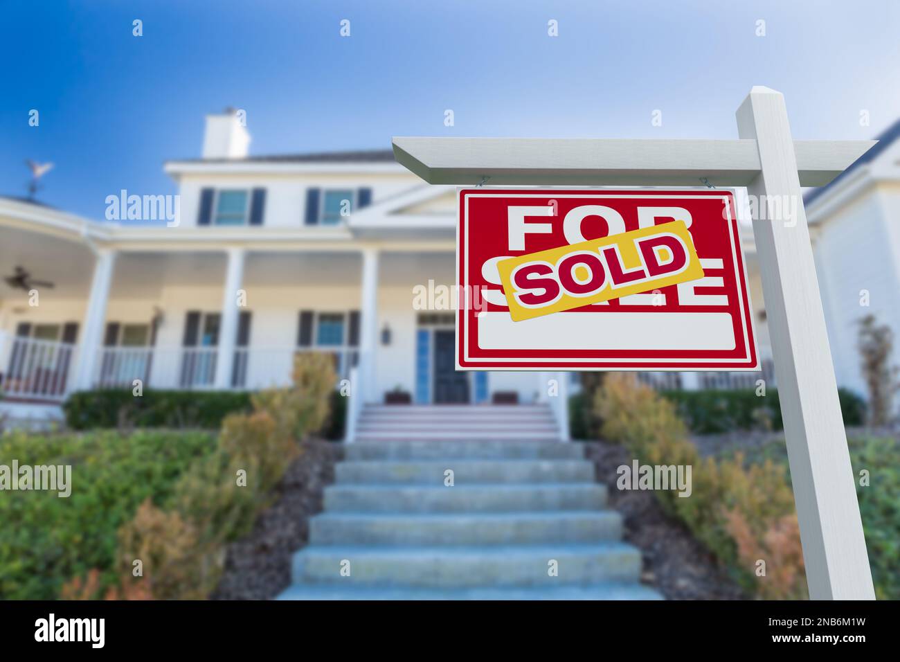 Sold For Sale Real Estate Sign in Front of New House Stock Photo - Alamy