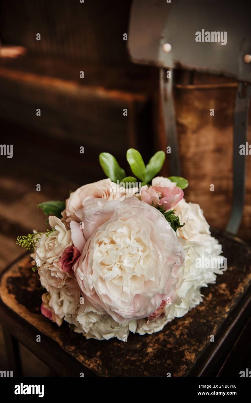 Bouquet of flowers sitting on a chair Stock Photo - Alamy