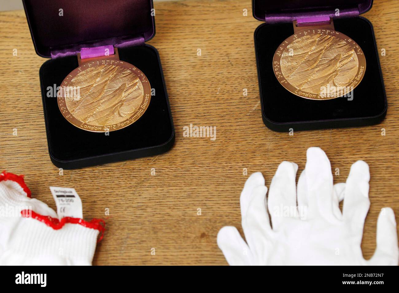 The London 2012 Paralympic gold medals designed by jewellery artist Lin