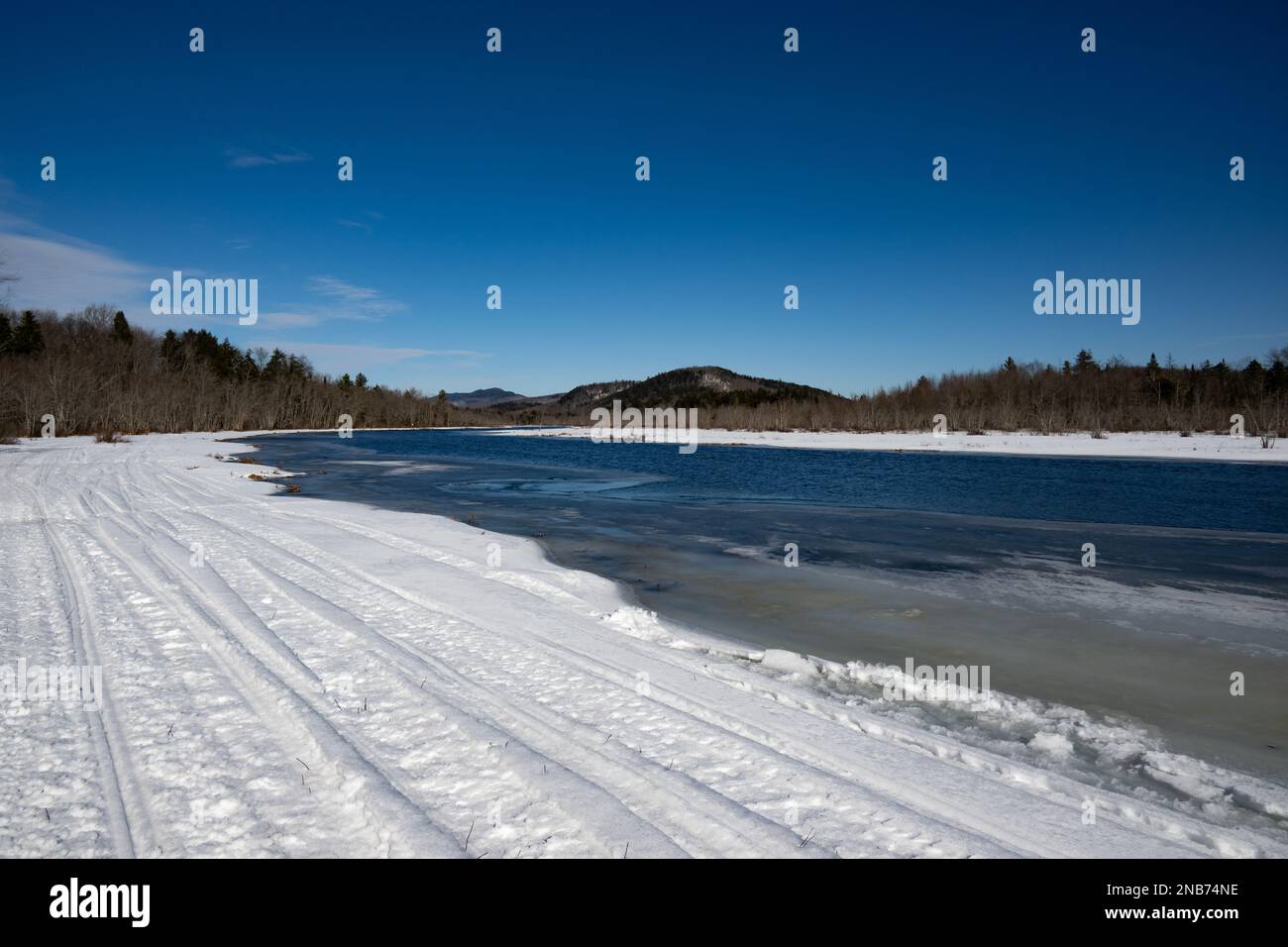 A winter view of the Adirondack Mountains from a snowmobile trail along the Sacandaga River near Speculator, NY Stock Photo