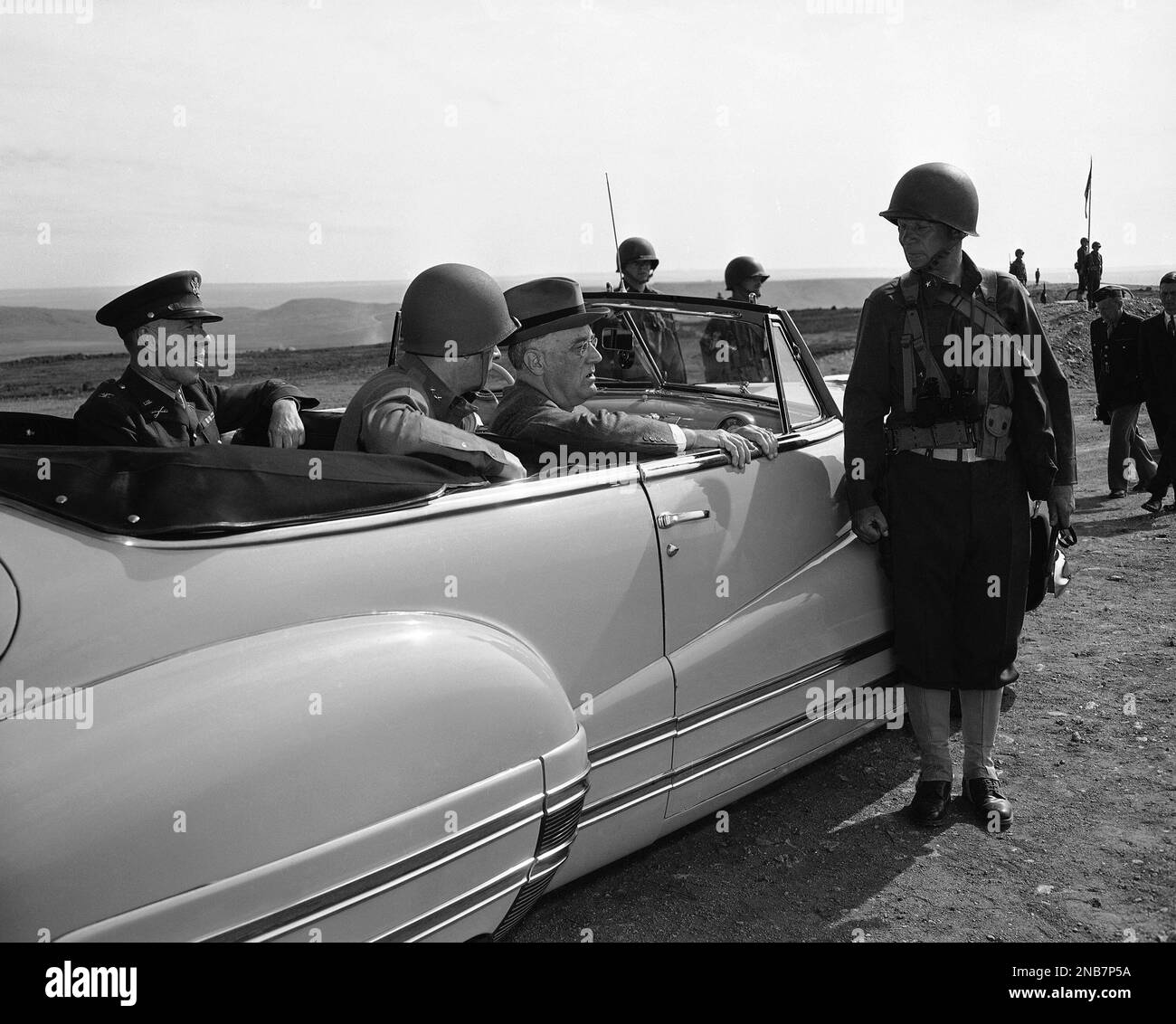 In car from left to right Col. Norman N. Winn, chief of staff; Lieut