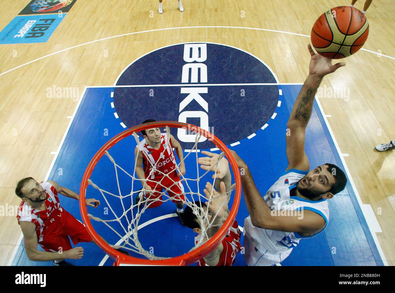 Greece's Ioannis Bourousis throws on basket during the EuroBasket 2011,  European Basketball Championships group F match between Greece and Georgia  in Vilnius, Lithuania, on Monday, Sept. 12, 2011. (AP Photo/Mindaugas  Kulbis Stock