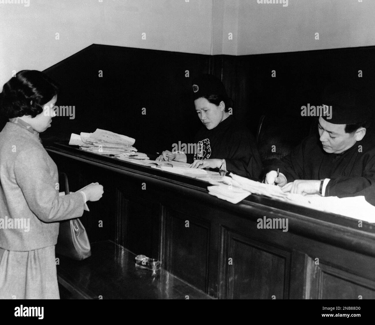 Mrs. Hwang YoonSuk, 31yearold Korean woman jurist, centre, listens
