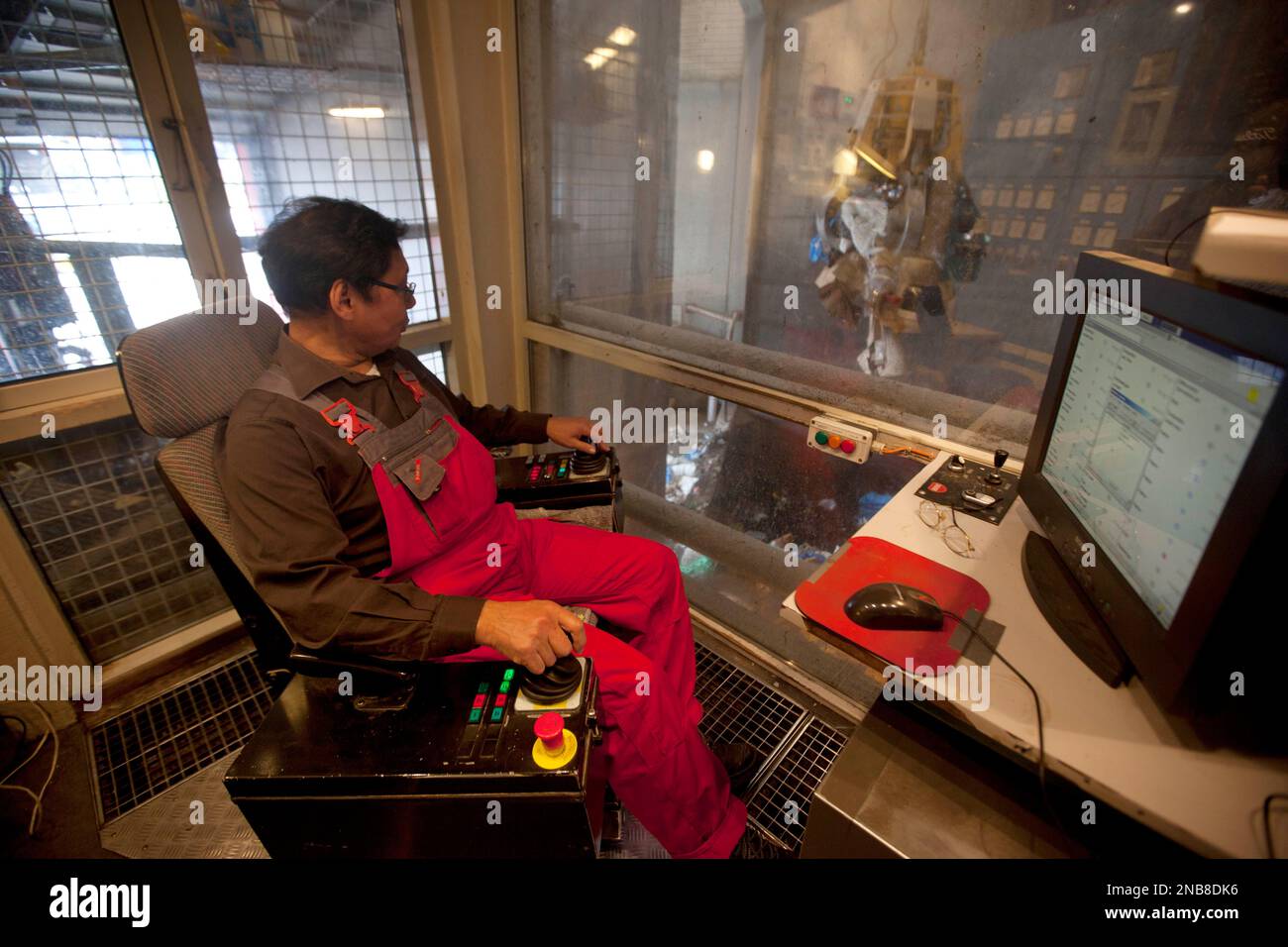 This July 26, 2011 photo shows Vittus Henson, 64, at his job as an equipment operator at a