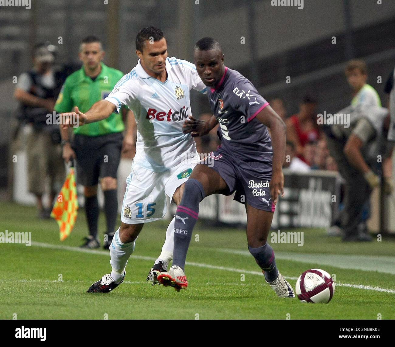 Marseille's French defender Jeremy Morel, left, challenges for the ball