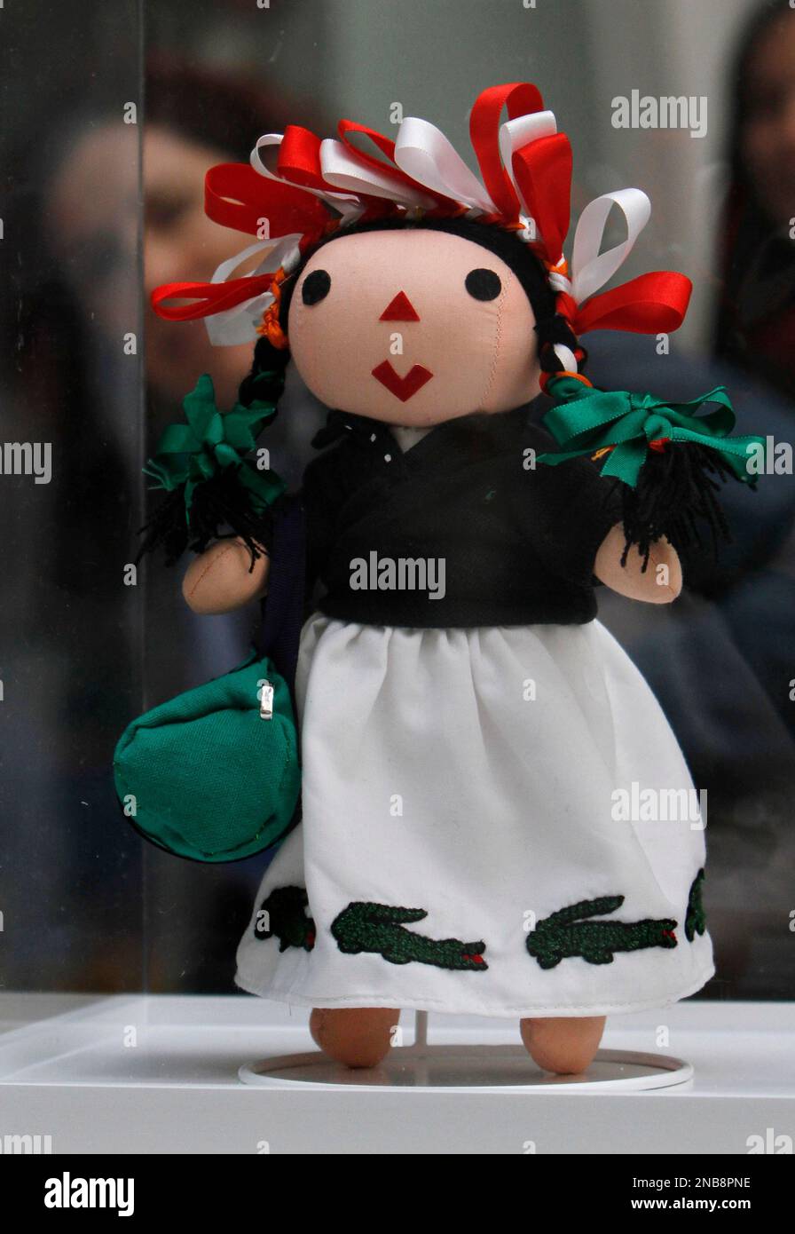 A traditional Mexican Maria Doll, dressed by French label Lacoste ...