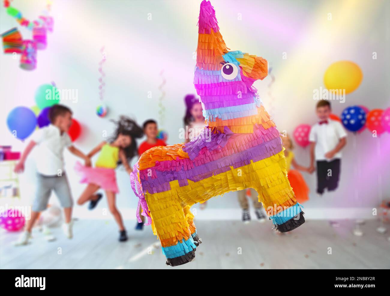 Playing with pinata hi-res stock photography and images - Alamy