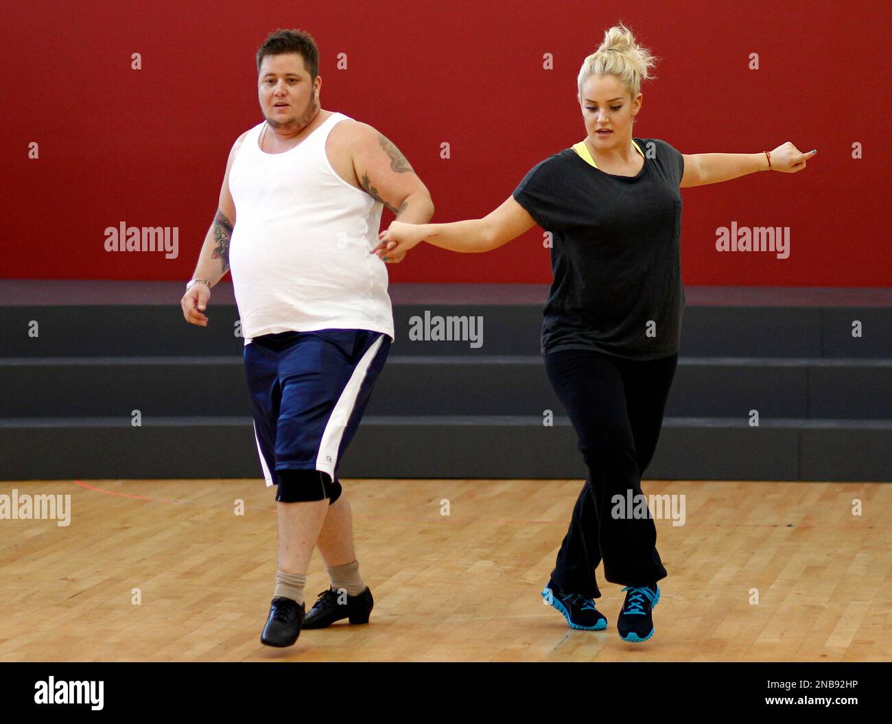 Chaz Bono, left, and Lacey Schwimmer practice dance steps while
