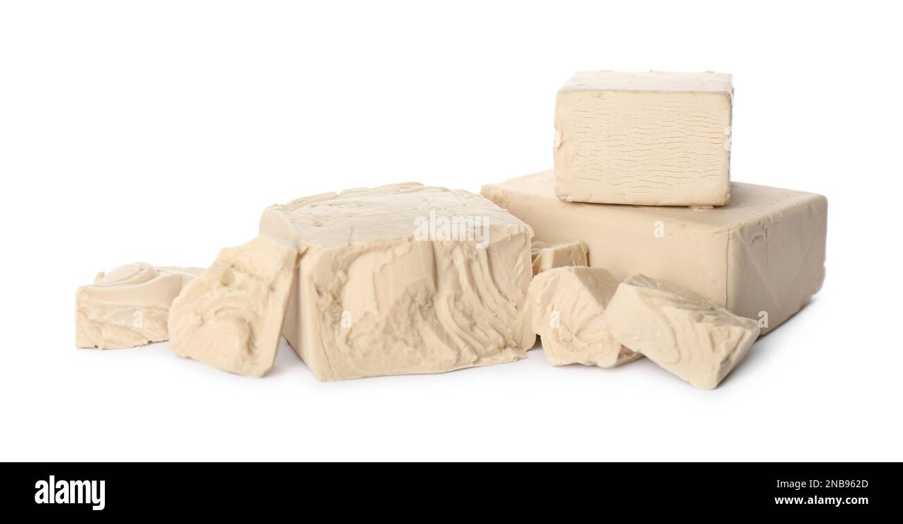 Pieces of compressed yeast on white background Stock Photo Alamy