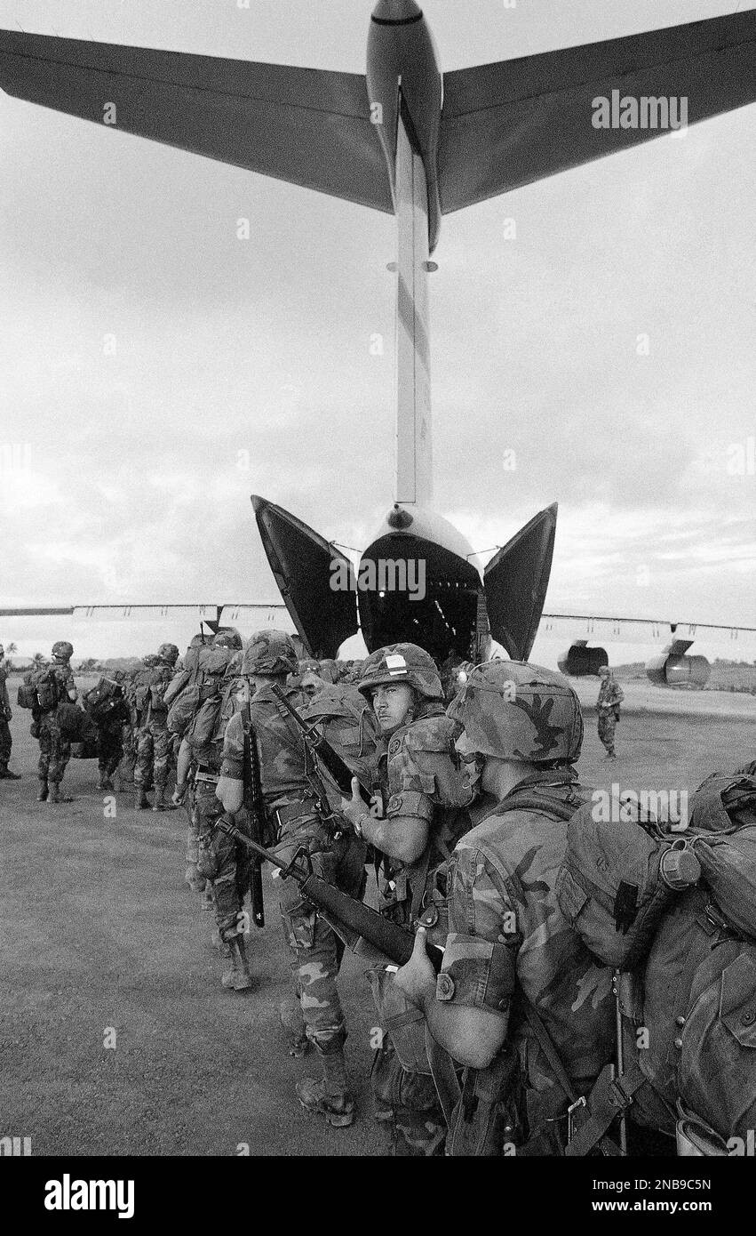 An 82nd Airborne trooper looks over his shoulder to take a last look at ...