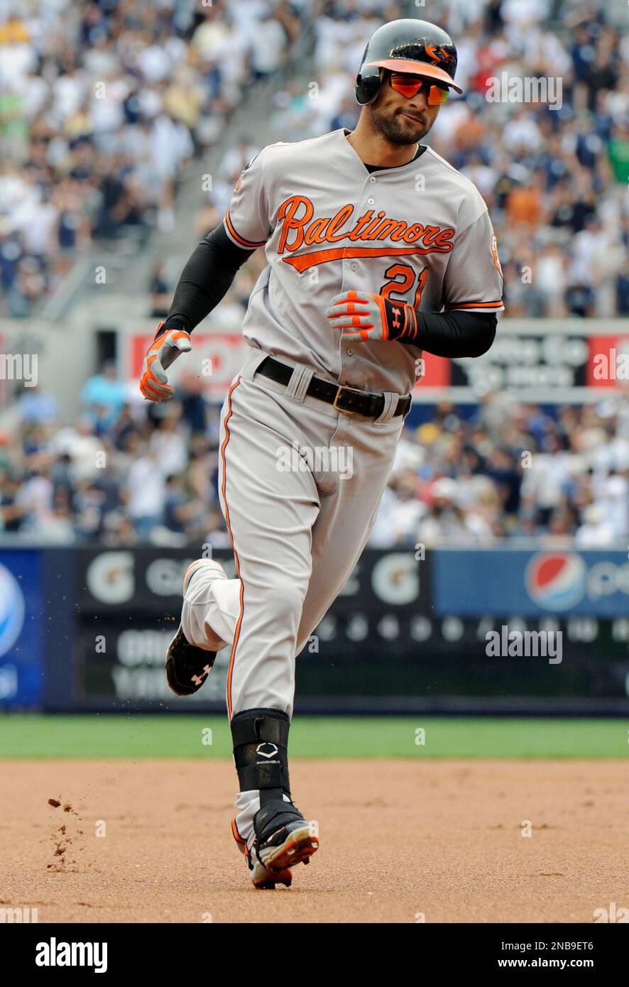 Baltimore Orioles' Nick Markakis rounds the bases after hitting a home run  during the first inning of a baseball game New York Yankees Monday, Sept.  5, 2011 at Yankee Stadium in New
