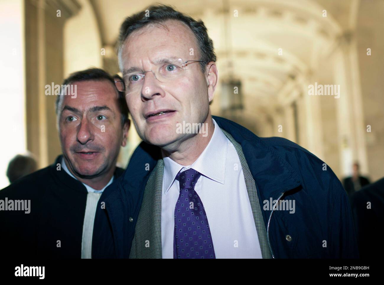 Defendant Jean De Gaulle, a grand-son of late President Gen. Charles de  Gaulle, arrives with his lawyer Benoit Chabert, left, at the Paris  courthouse for Jacques Chirac's trial, Monday, Sept. 5, 2011.