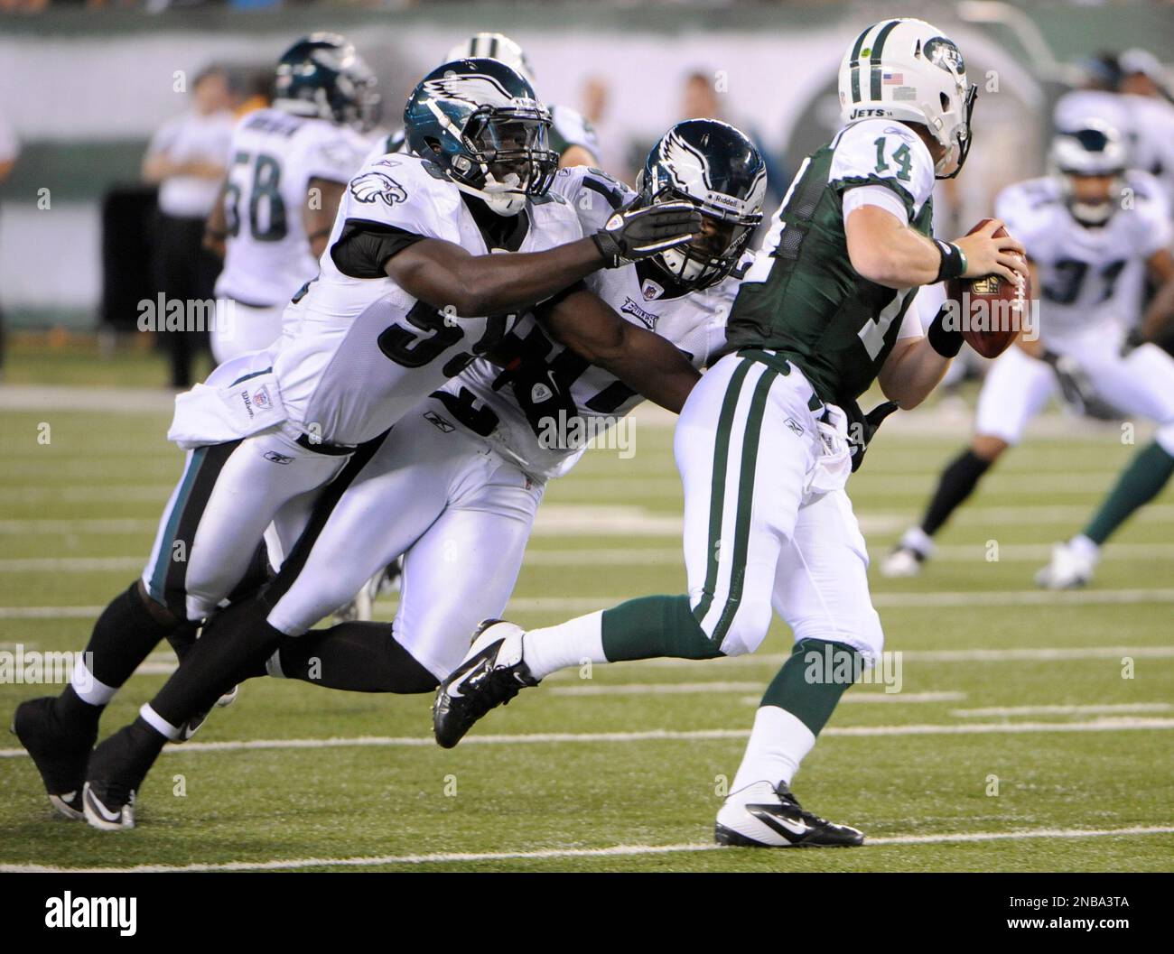 Philadelphia Eagles' Brian Rolle, left, and Keenan Clayton, center