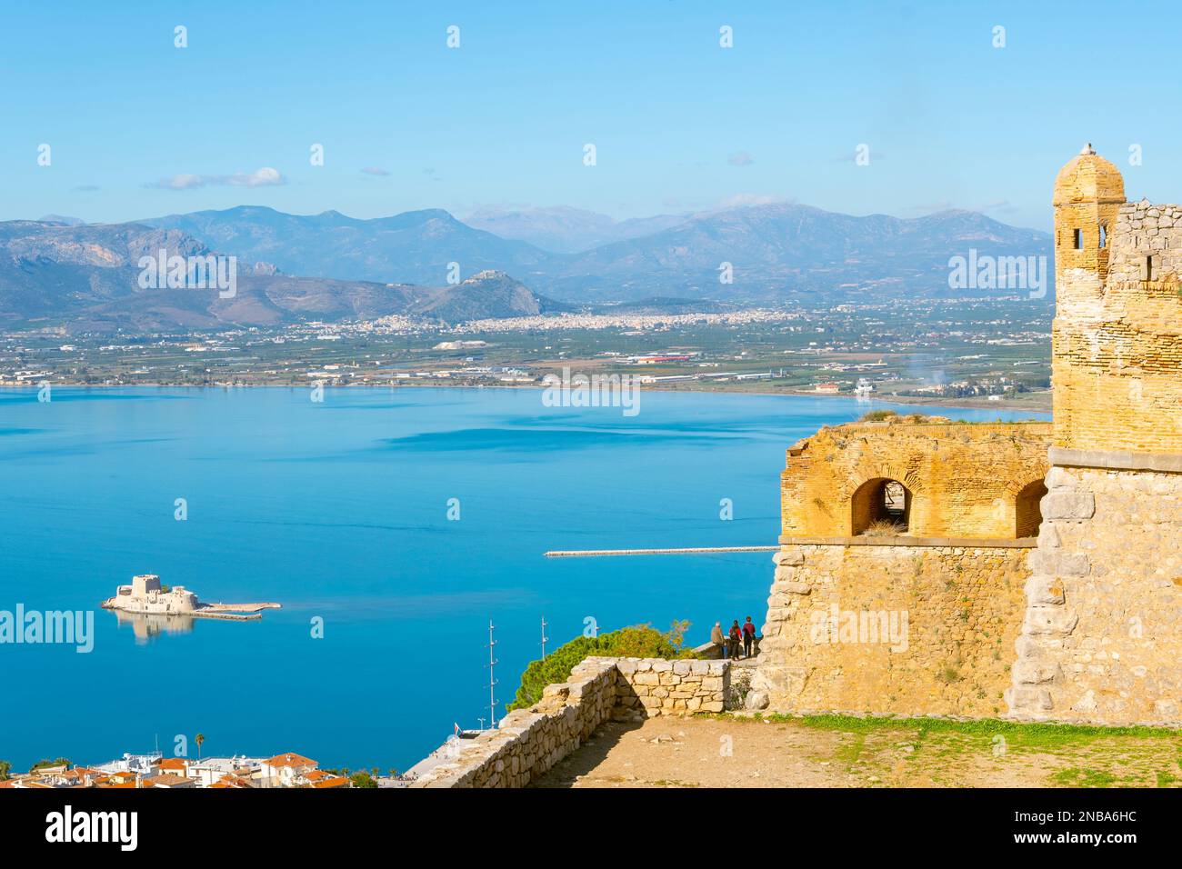 View from the ancient fortress of Palamidi above the Aegean Sea and the town of Nafplio, with the Bourtzi Castle in view in the blue waters of the bay Stock Photo
