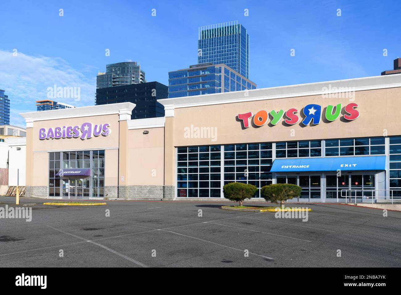 Bellevue, WA, USA - February 12, 2023; Closed Toys R Us and Babies R Us store facade in Bellevue WA with company logo and empty car park Stock Photo