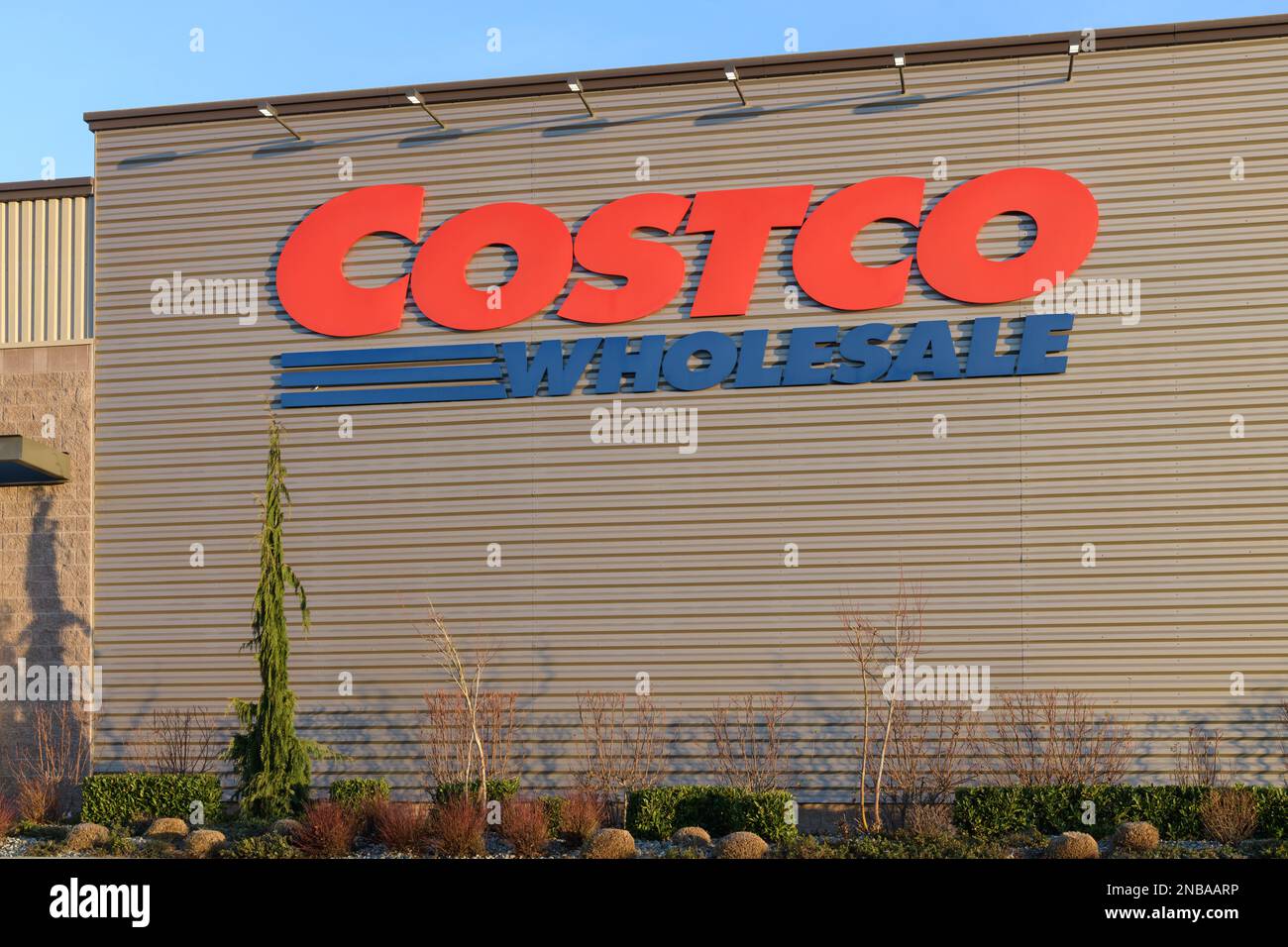 Redmond, WA, USA - February 12, 2023; Large sign of Costco Wholesale on side of metal warehouse wall Stock Photo