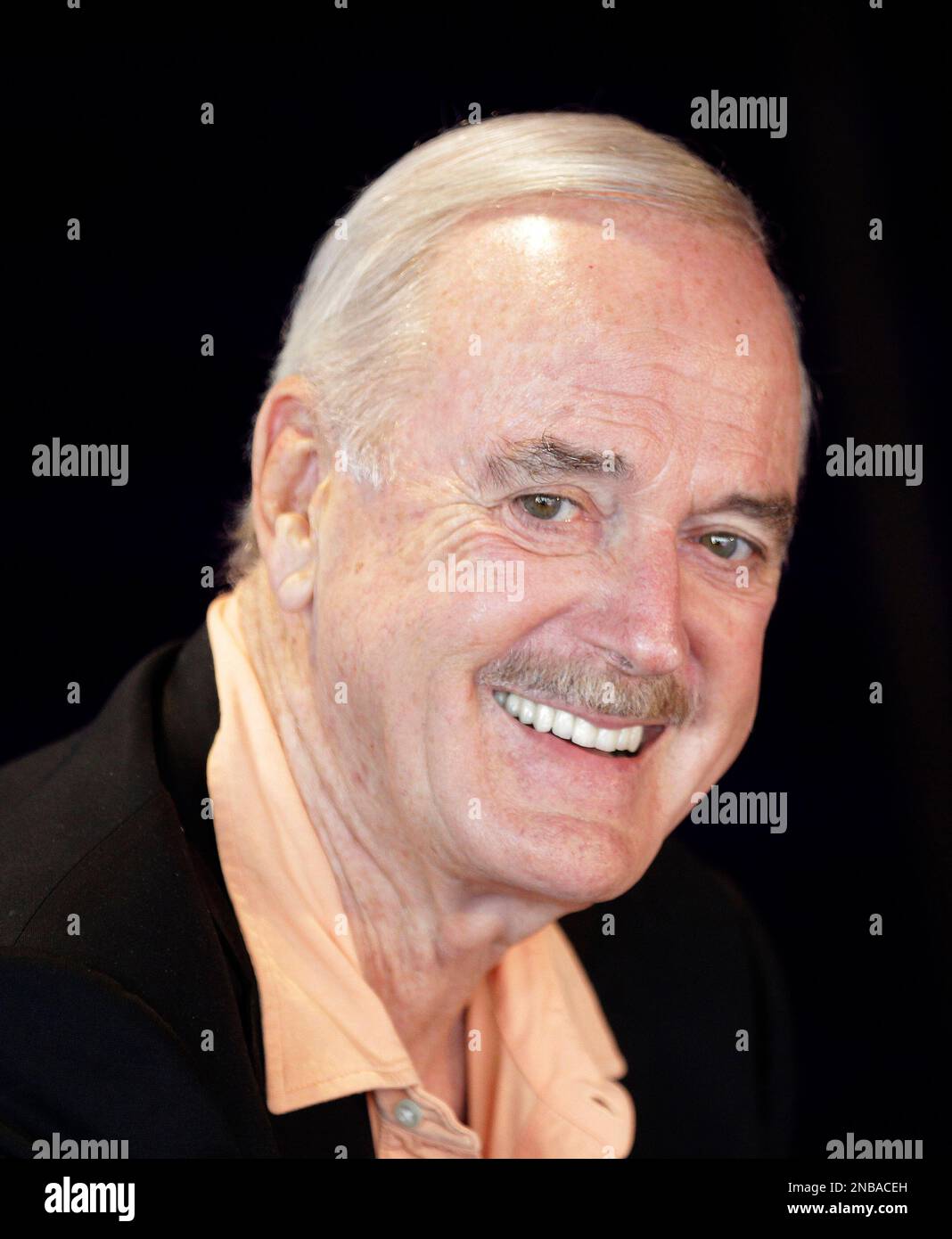 Comedian John Cleese speaks during a press conference at the Opera