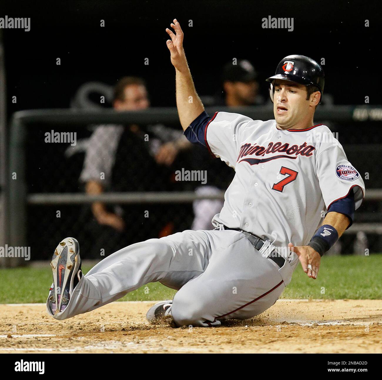 Minnesota Twins' Joe Mauer scores off a hit by Michael Cuddyer, during the  fifth inning of a baseball game Tuesday, Aug. 30, 2011 in Chicago. (AP  Photo/Charles Rex Arbogast Stock Photo - Alamy