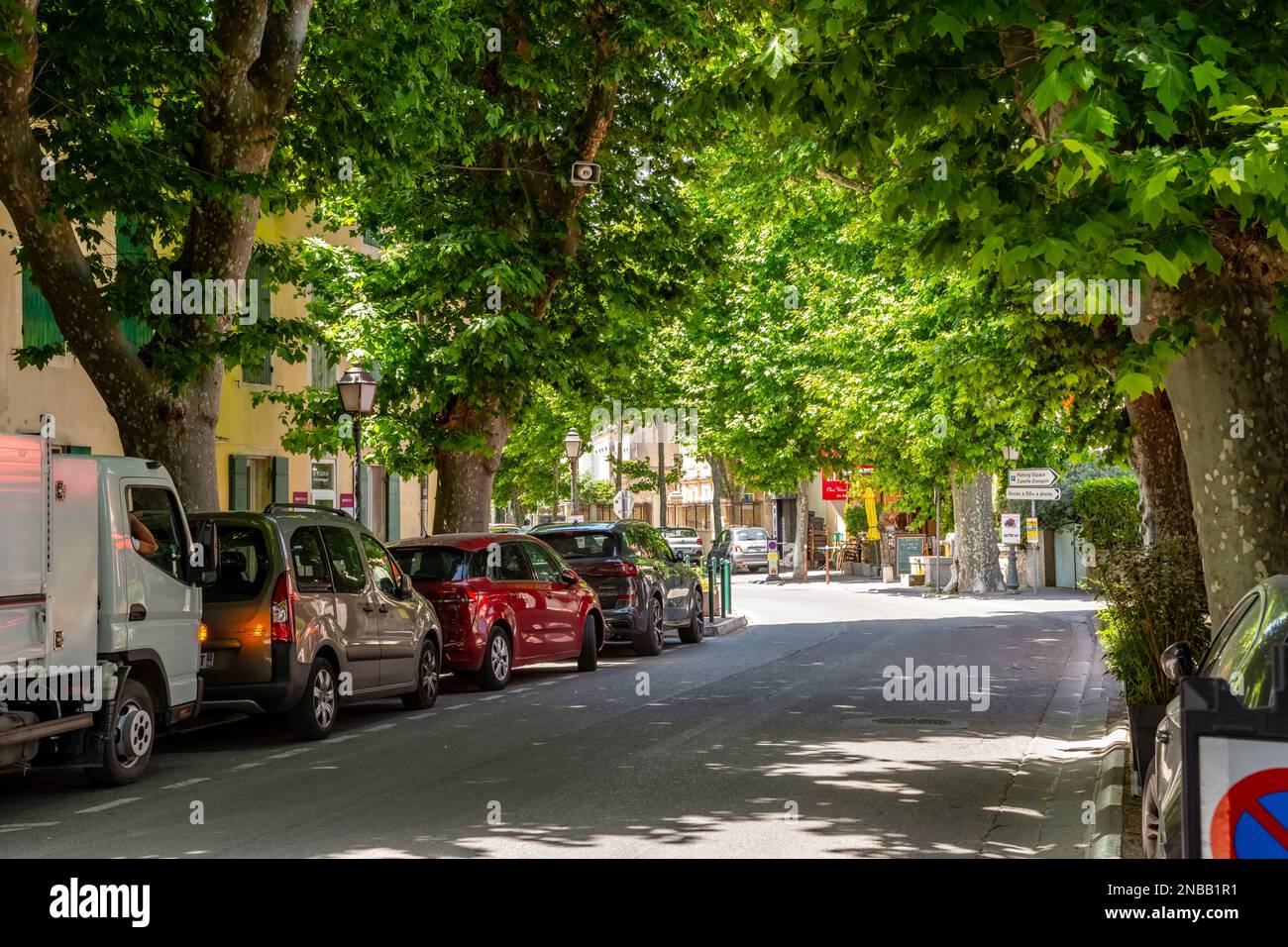 A shady tree lined street in the historic old town of Saint-Remy-de-Provence, France. Stock Photo