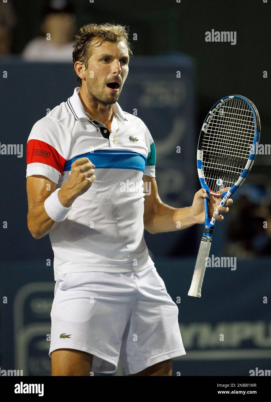 Julien Benneteau, of France, celebrates a point against Robin Haase, of the  Netherlands, during semifinal play at the Winston-Salem Open tennis  tournament in Winston-Salem, N.C., Friday, Aug. 26, 2011. Benneteau won 3-6,