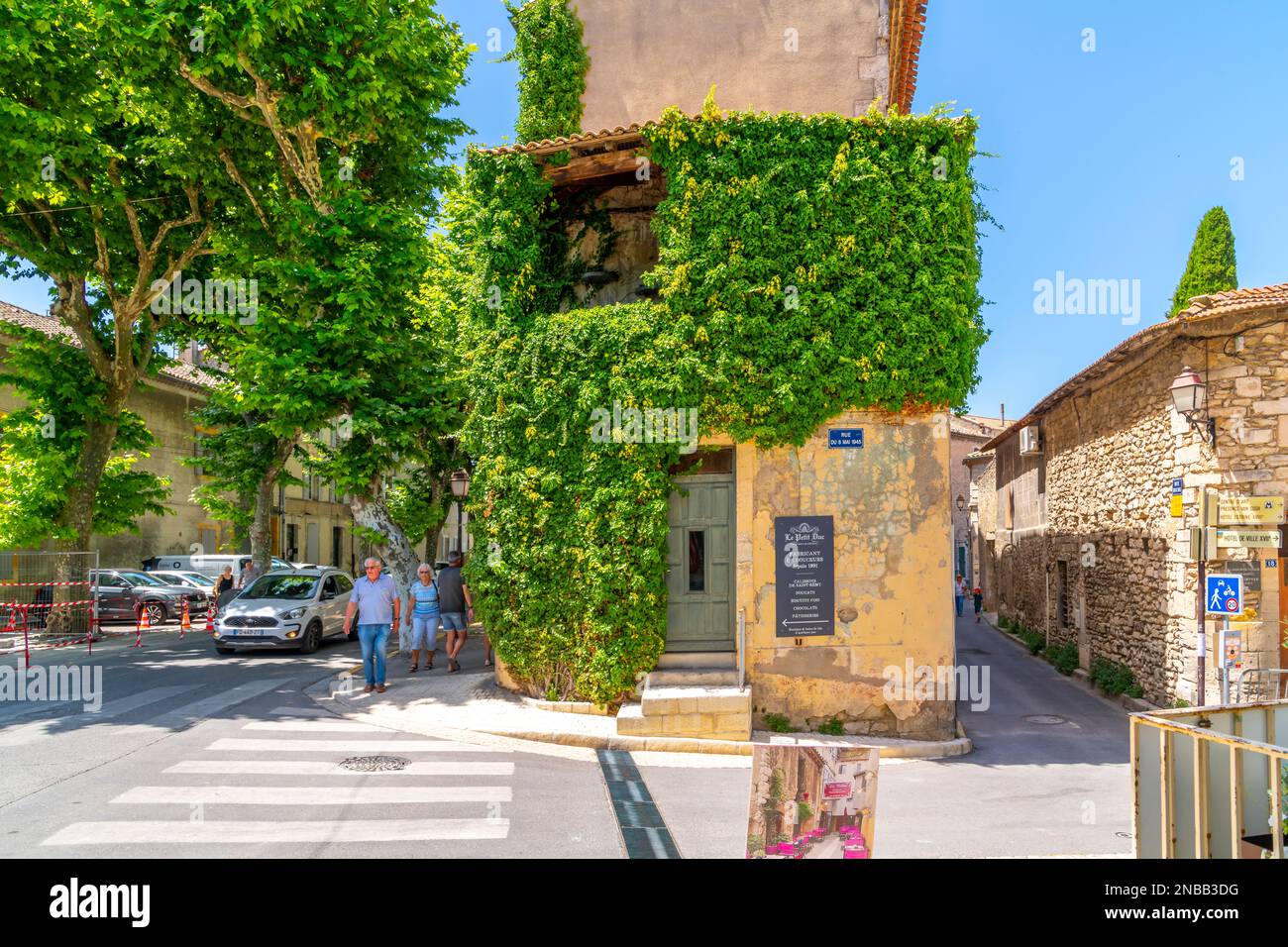 An ivy covered historic building in the medieval old town of Saint Remy in the Provence Cote d'Azur region of Southern France. Stock Photo