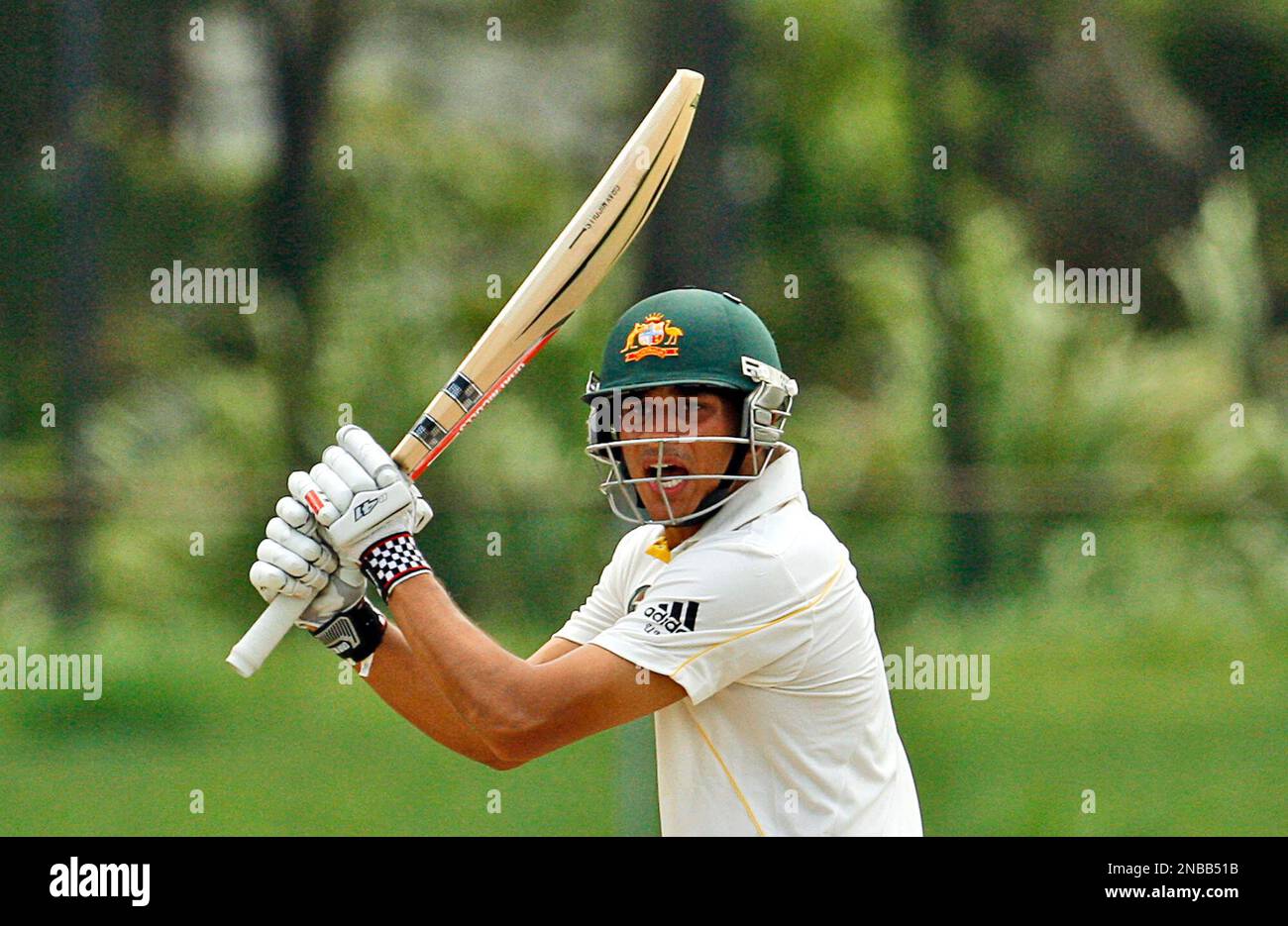 Australian cricketer Usman Khawaja bats during a cricket practice match