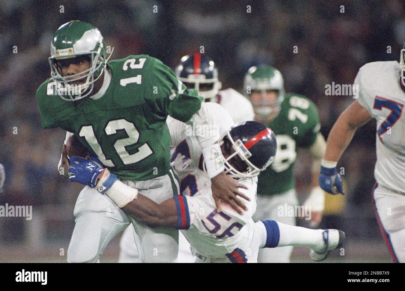 https://c8.alamy.com/comp/2NBB7X9/philadelphia-eagles-quarterback-randall-cunningham-is-tackled-by-new-york-giants-lawrence-taylor-as-he-ran-for-a-three-yard-gain-in-the-fourth-quarter-of-game-at-veterans-stadium-in-philadelphia-on-sunday-nov-15-1987-taylor-was-injured-on-the-play-and-helped-off-the-field-the-giants-won-the-game-20-17-ap-photopeter-morgan-2NBB7X9.jpg