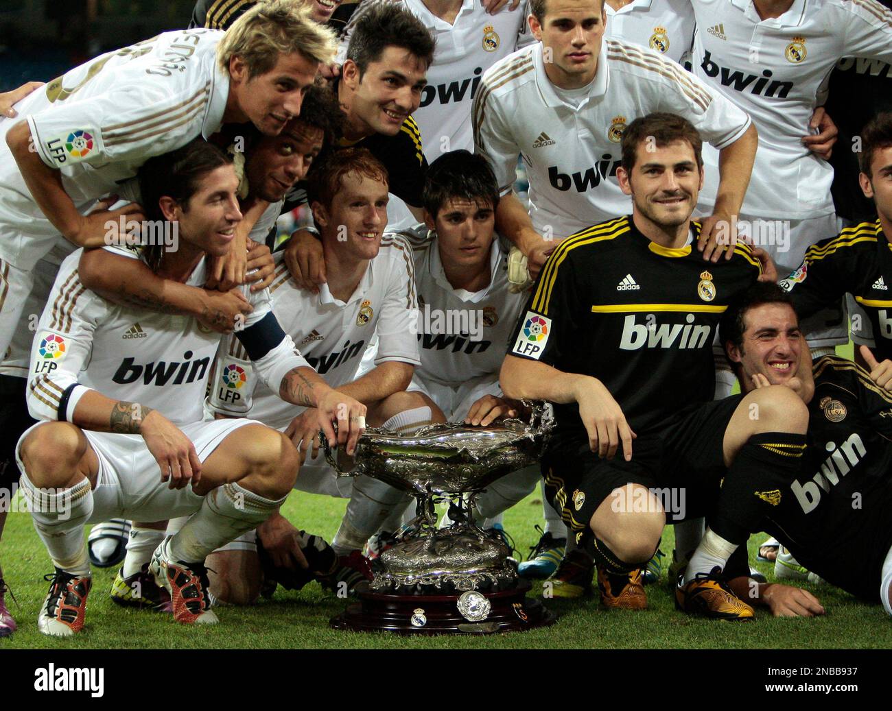 Real Madrid's members poses with the trophy after their win in the ...