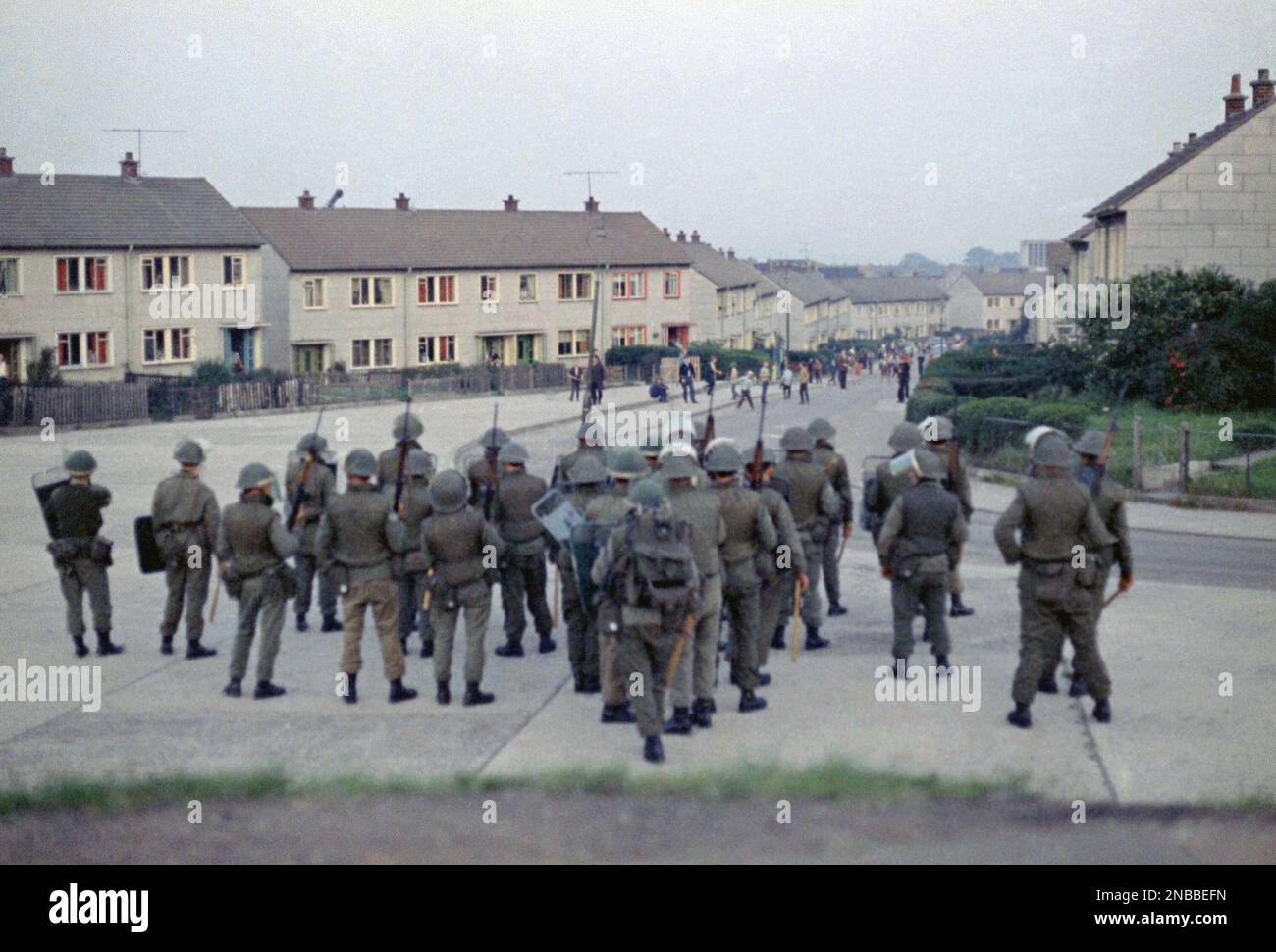 British troops confront young rioters on the Ballymurphy Estate in
