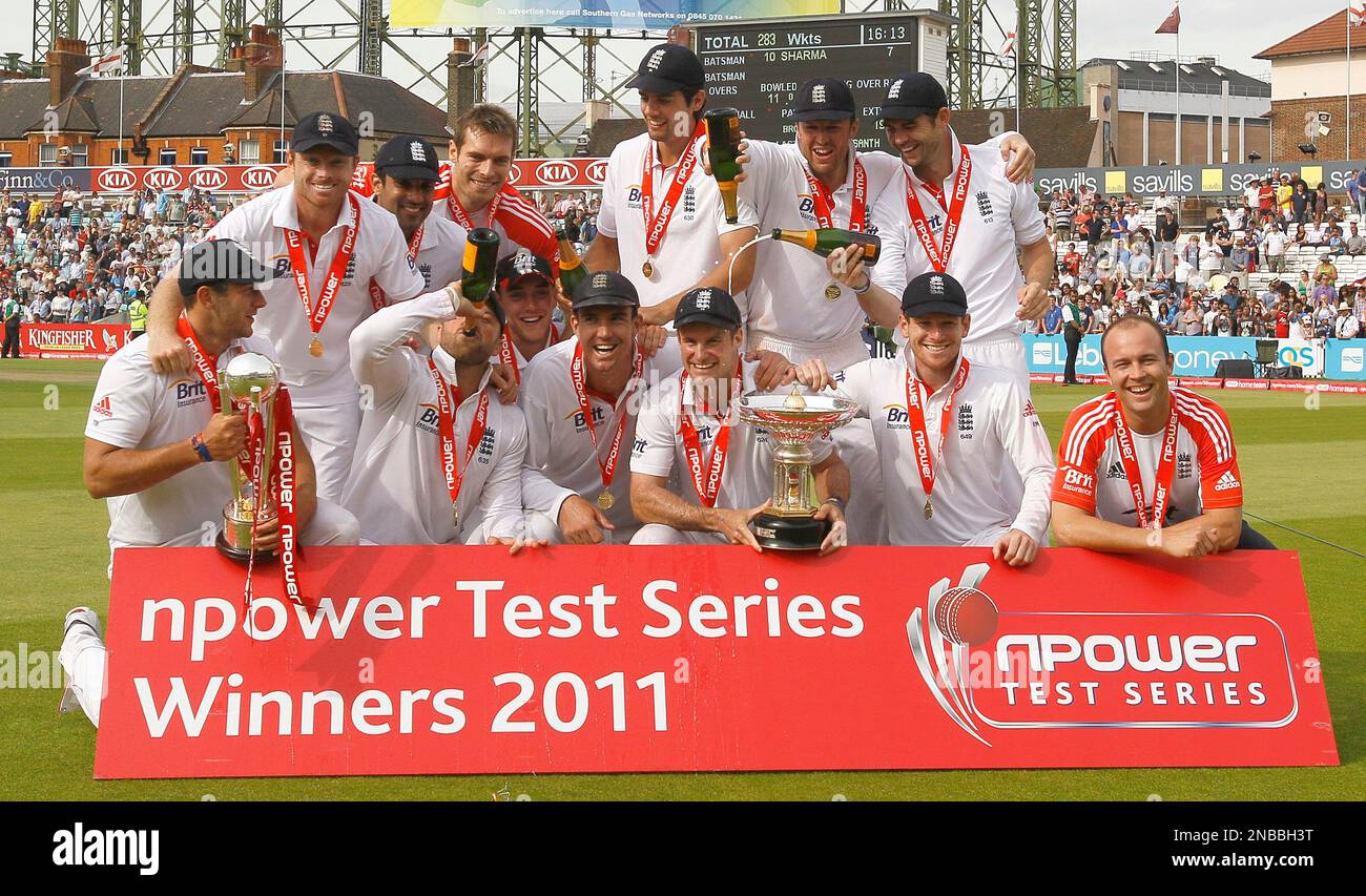 England's captain Andrew Strauss, centre right, and his team celebrate