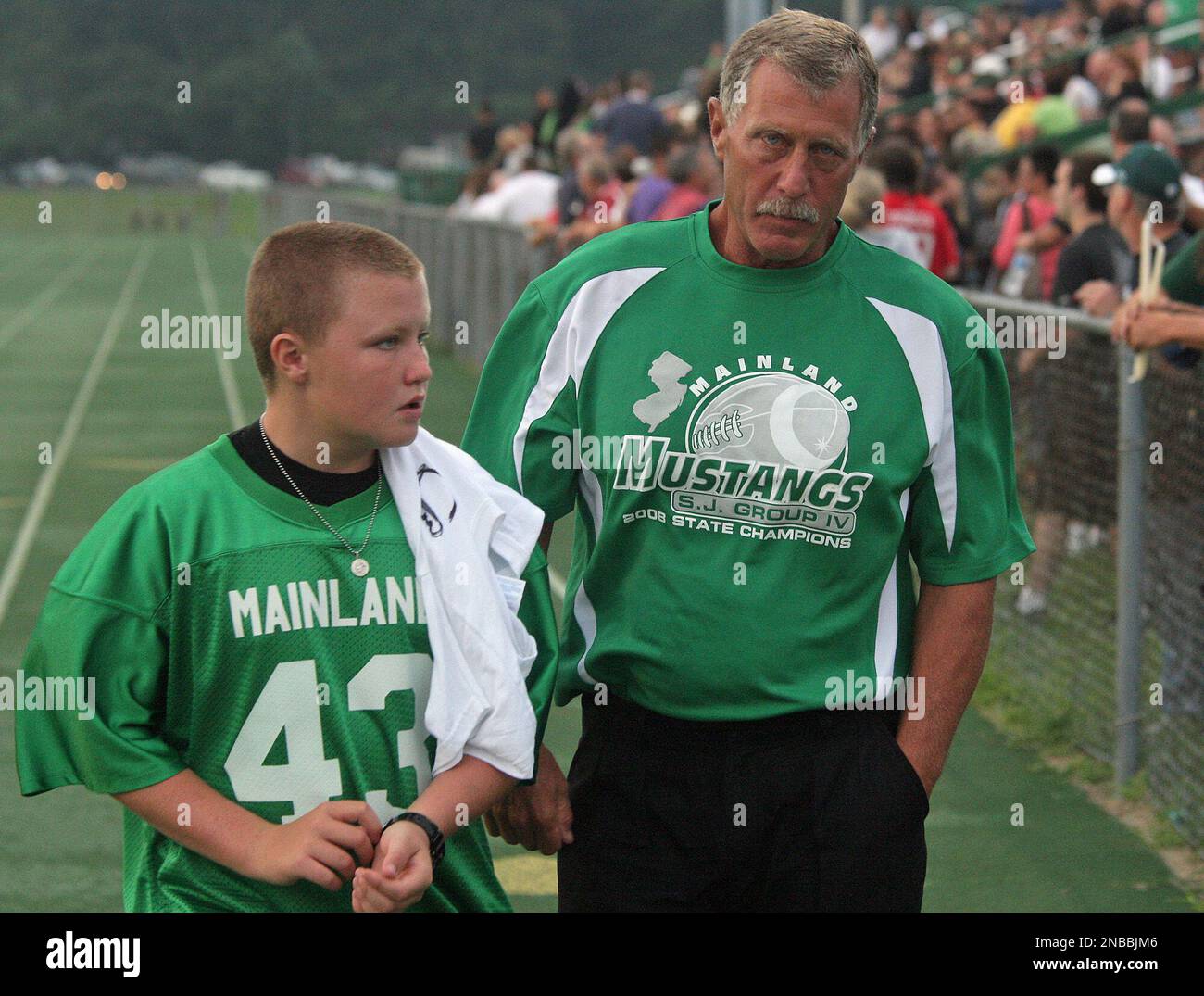 Mainland Regional High School head football coach Bob Coffey, right