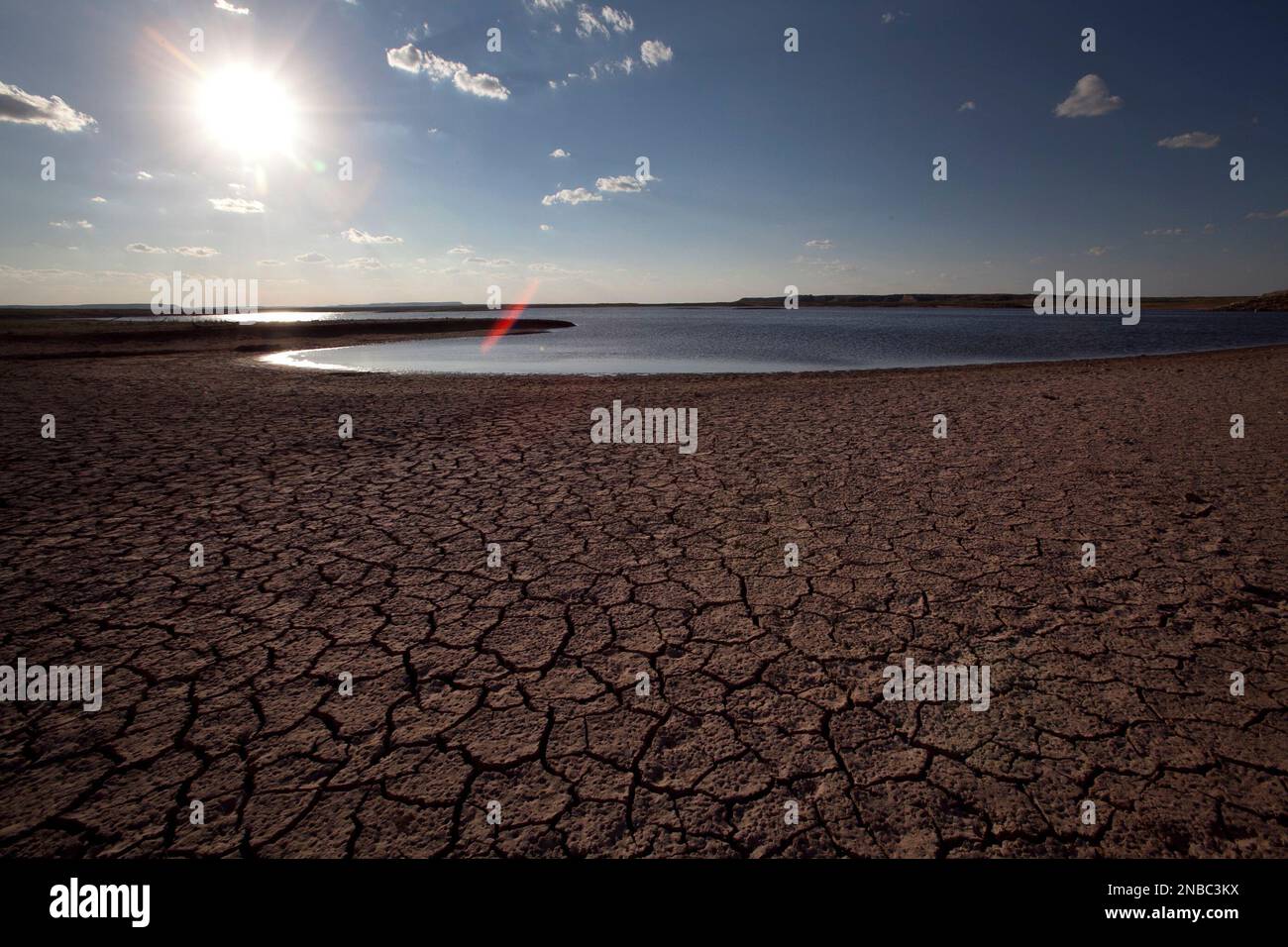 FILE In this Sunday Aug. 7, 2011 file photo, the dried lake bed of