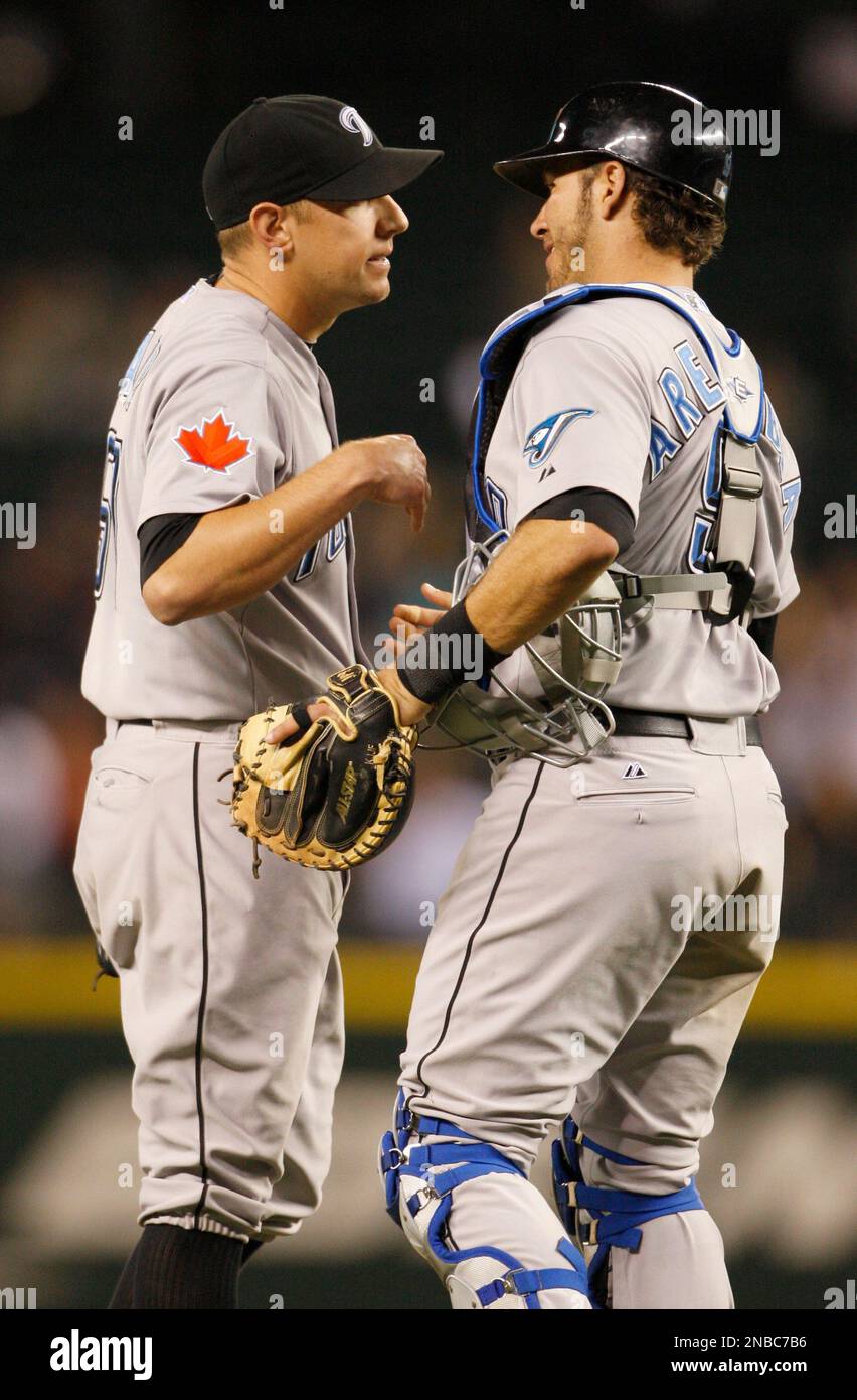 Toronto Blue Jays' Shawn Camp, left, congratulates teammate catcher J.P