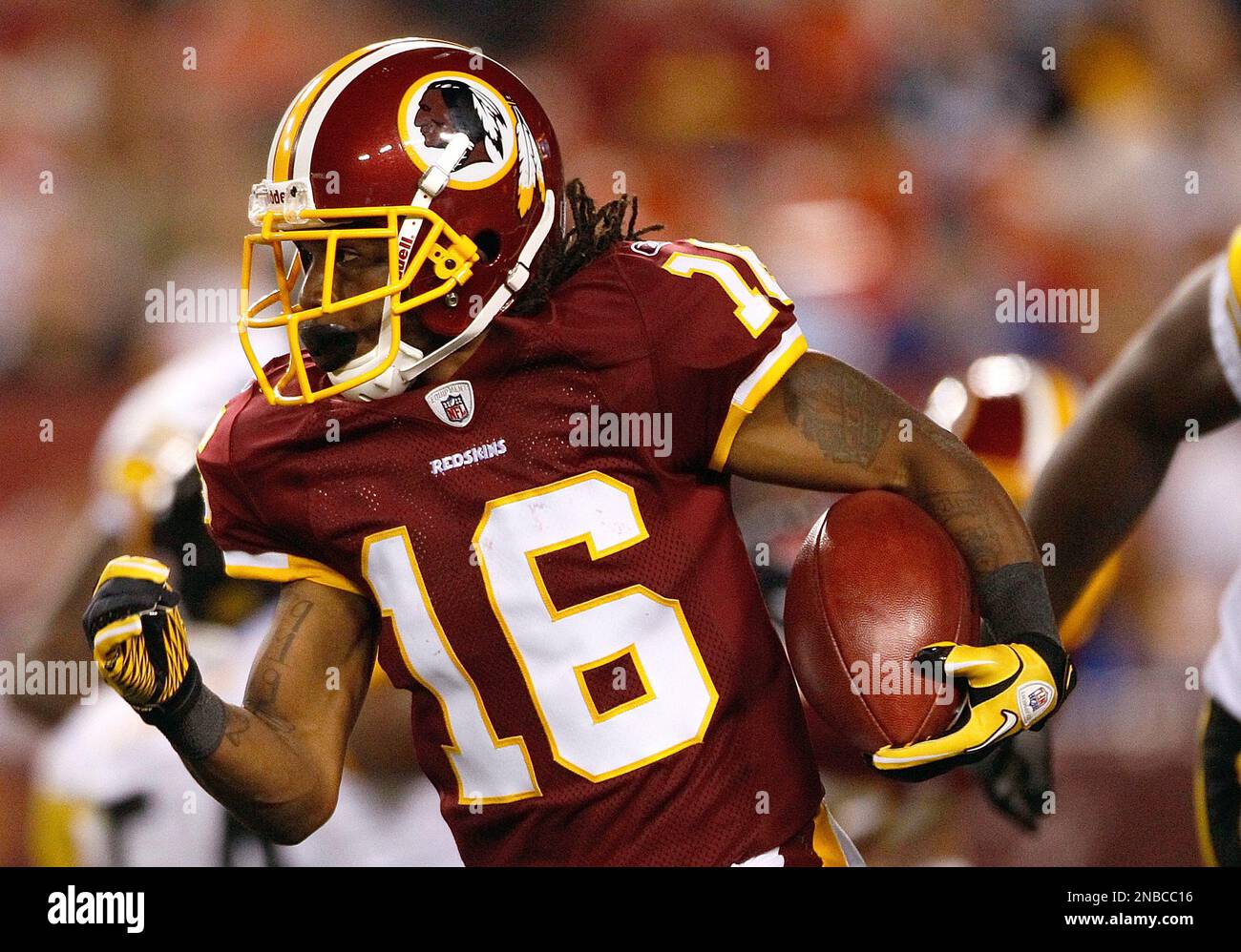 Washington Redskins wide receiver Brandon Banks carries the ball during the  first half of an NFL preseason football game against the Pittsburgh  Steelers in Landover, Md., on Friday, Aug. 12, 2011. (AP