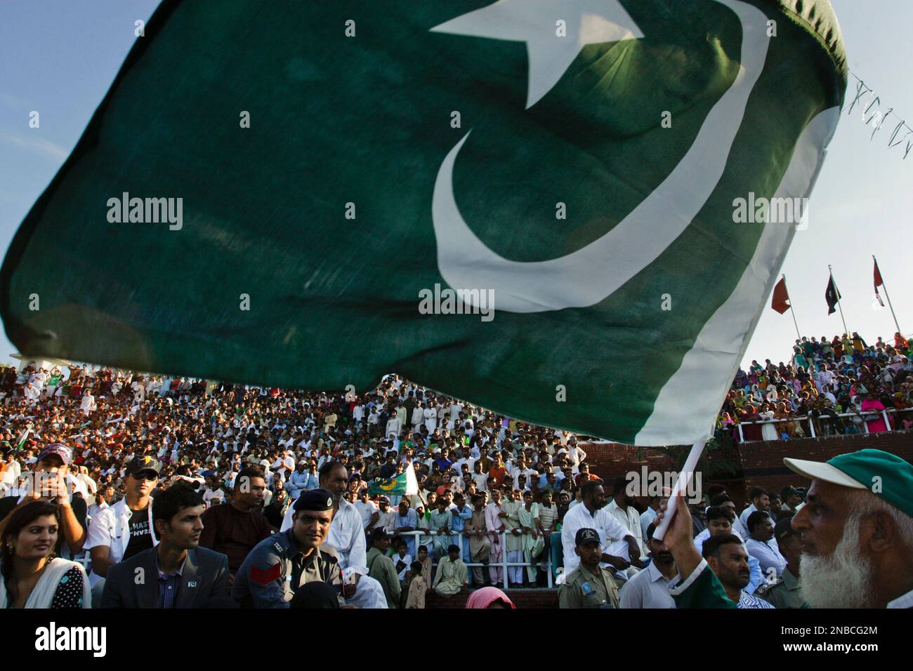 Pakistanis observe the "Beating the Retreat" or flag off ceremony on