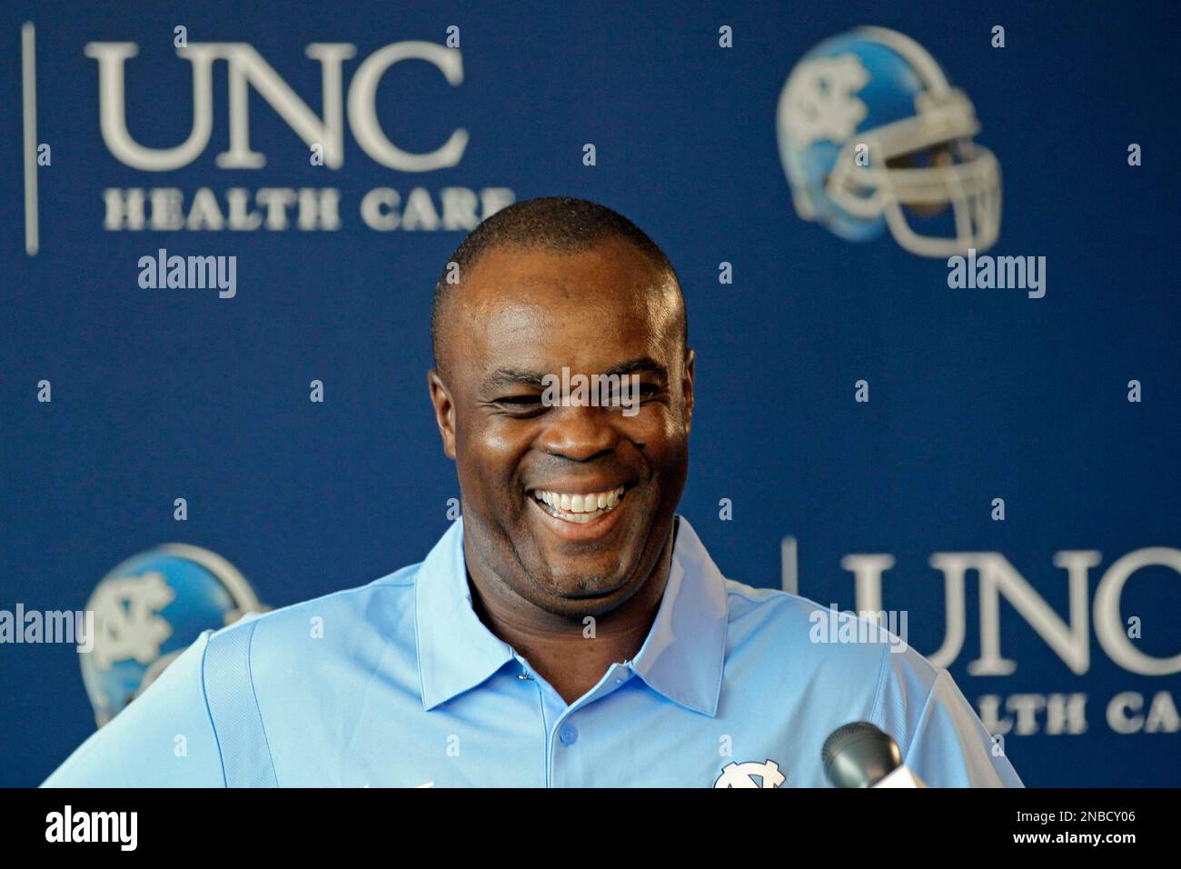 North Carolina football coach Everett Withers smiles while speaking