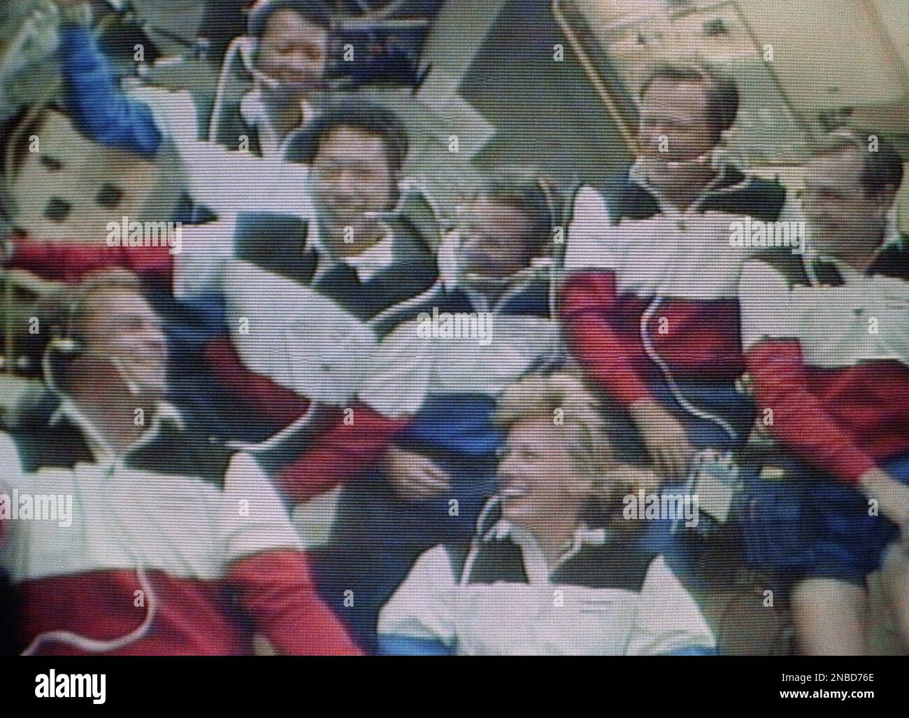 The crew of the space shuttle Endeavour share a laugh during the press