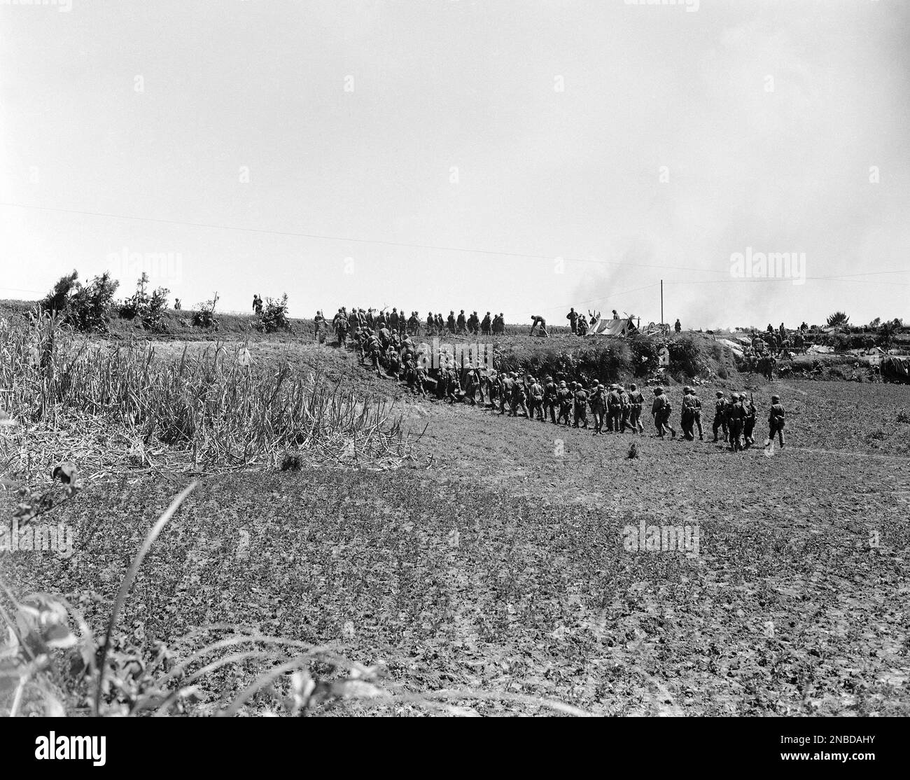 troops-en-route-to-the-front-lines-in-okinawa-japan-on-april-21-1945