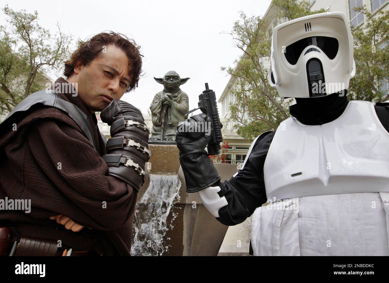 In this Aug. 2, 2011 photo, Matt Tolosa, left, who is dressed like the Star  Wars movie character Anakin Skywalker, while his brother Dale Tolosa,  right, who is dressed as a Stormtrooper,, image size:1300x947