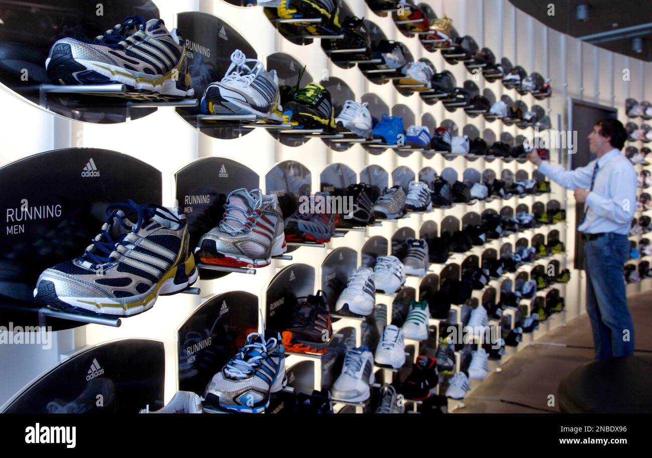 Herzogenaurach, Germany : Adidas store. Adidas s a German multinational  corporation that designs and manufactures sports clothing and ac Stock  Photo - Alamy