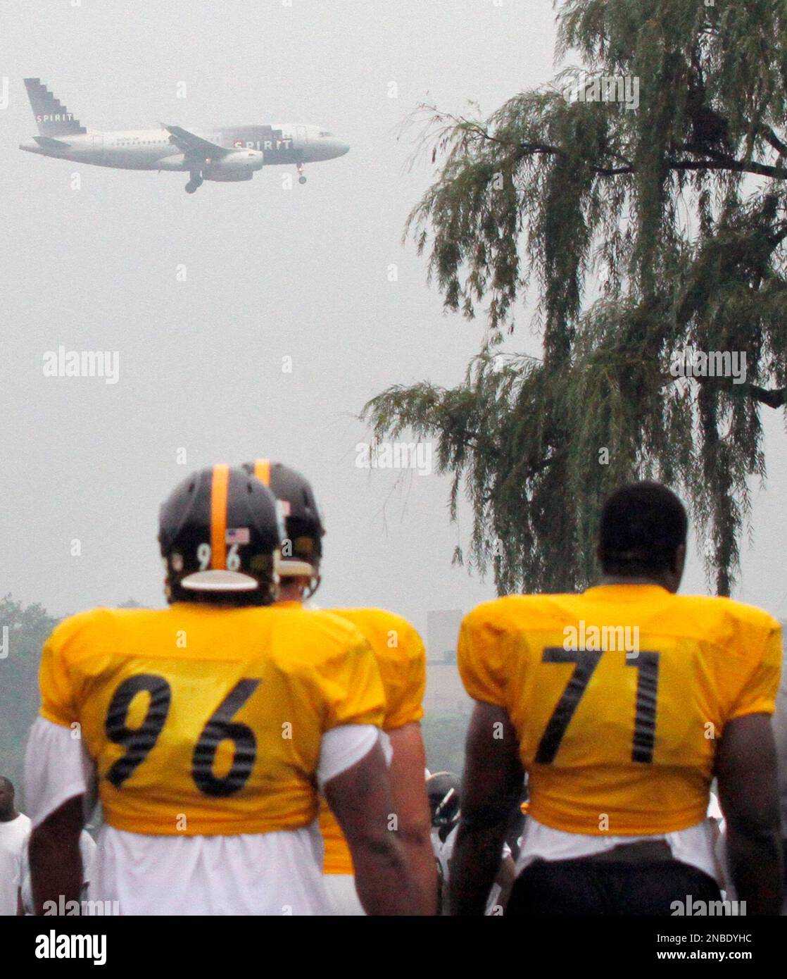 Pittsburgh Steelers stand along the edge of the practice field during