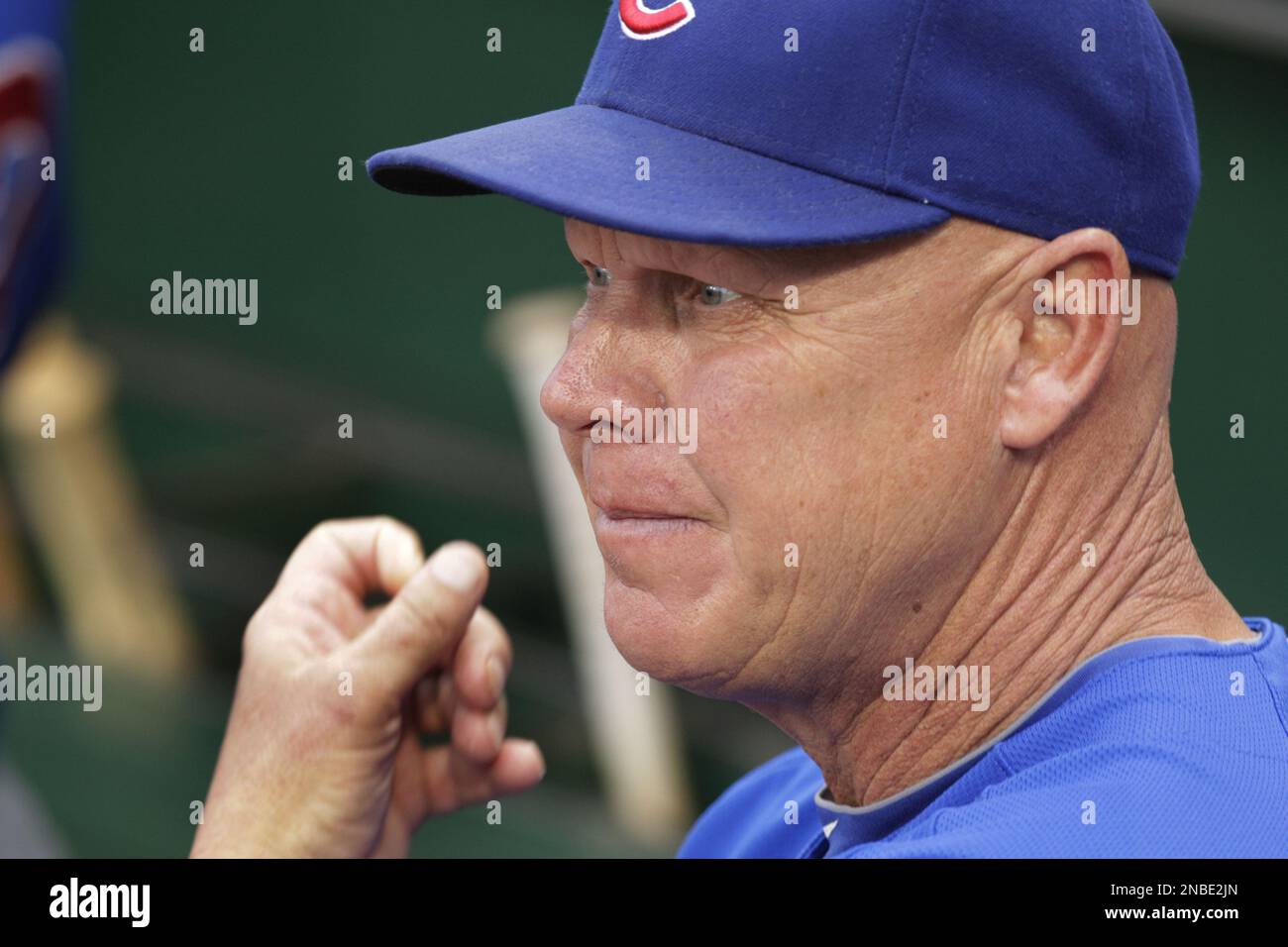 Chicago Cubs' manager Mike Quade stands in the dugout during a baseball