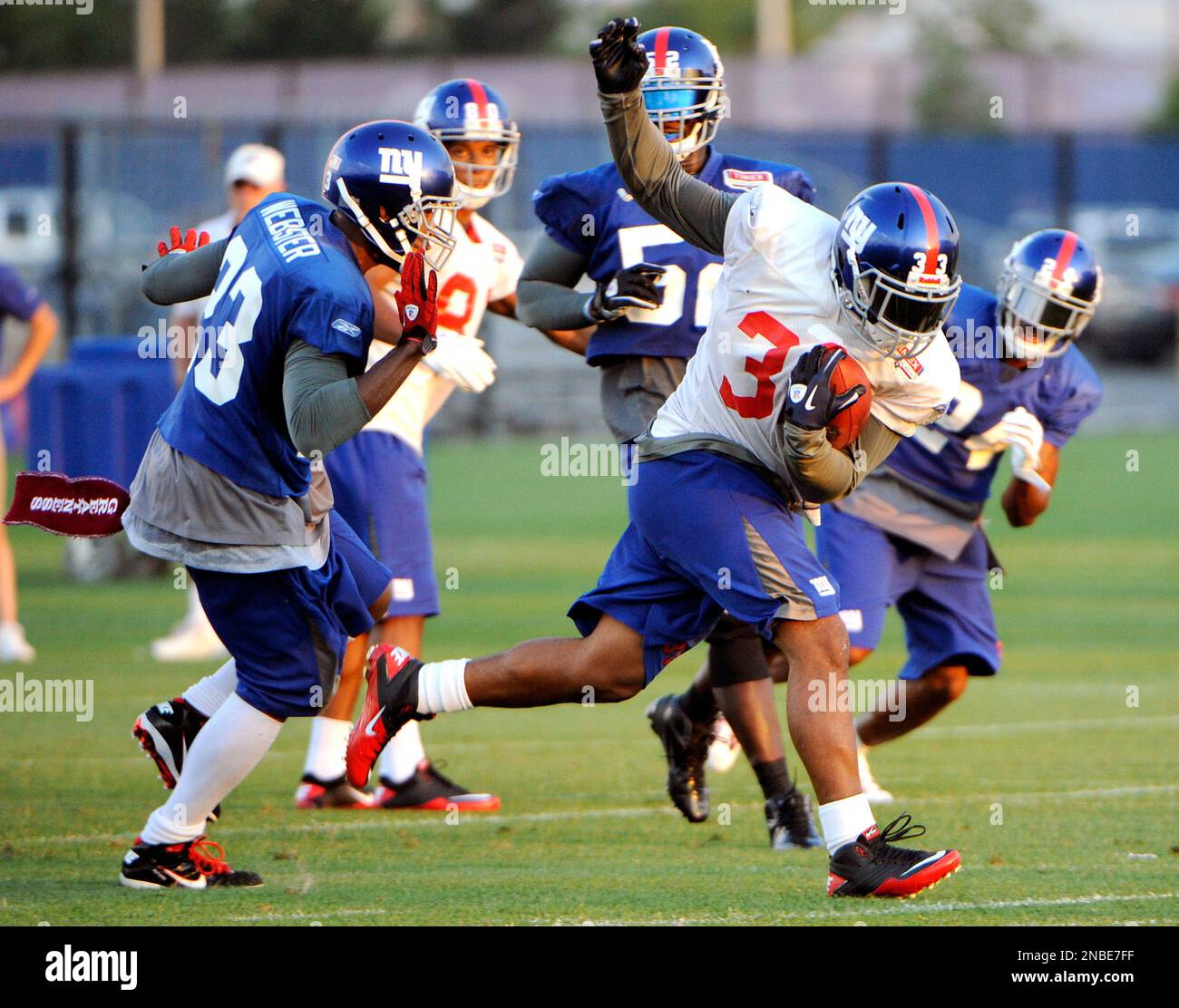 New York Giants running back Charles Scott, second from right, runs ...