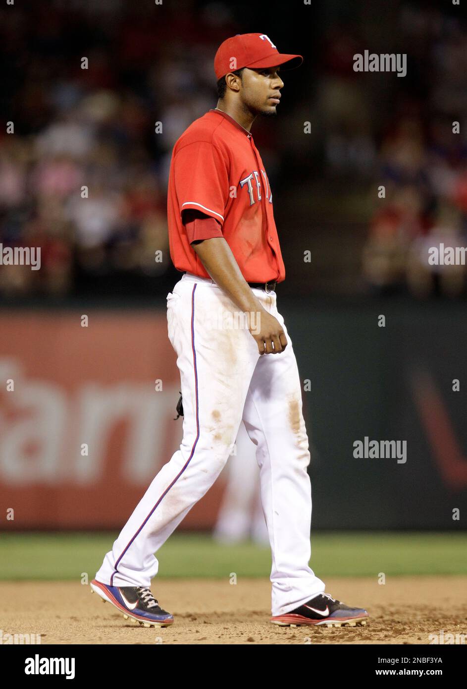 Texas Rangers shortstop Elvis Andrus backs up to his position after being  charged with a fielding error that allowed Minnesota Twins' Tsuyoshi  Nishioka to reach first safely in the ninth inning of