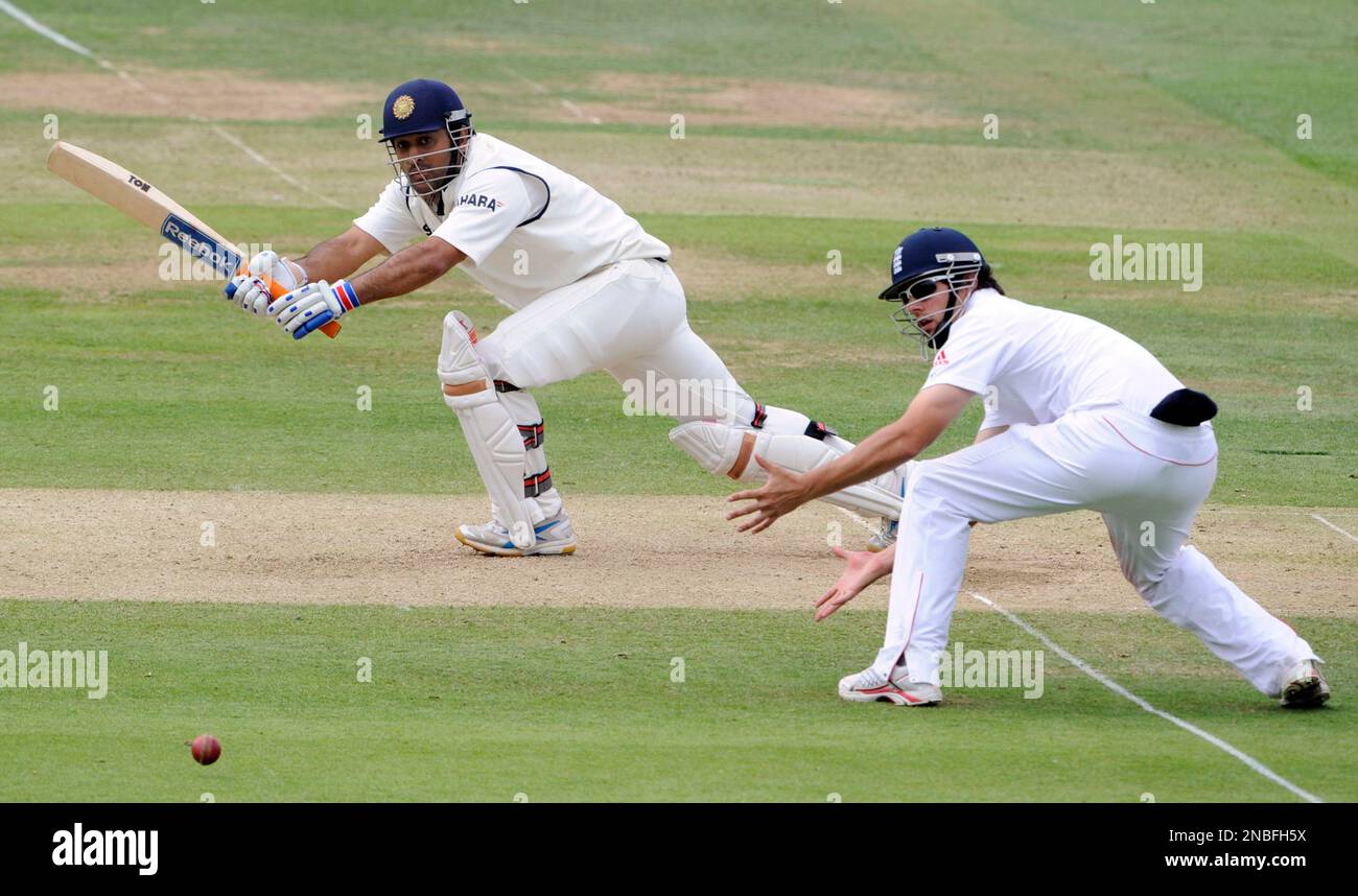 India's Mahendra Singh Dhoni, left, hits a ball from England's Graeme