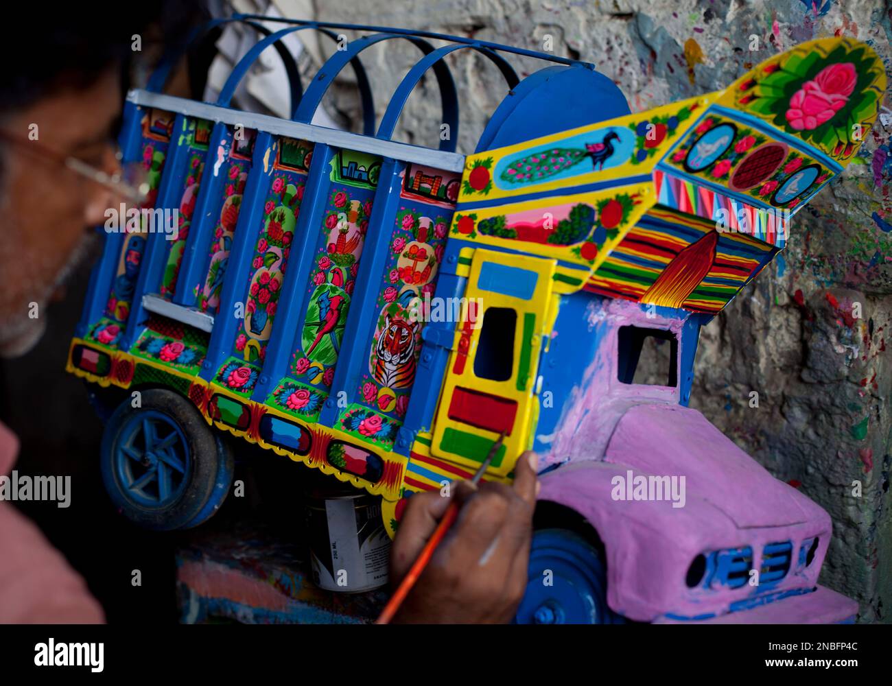 In this photo taken on July 18, 2011, an artist paints a model of a